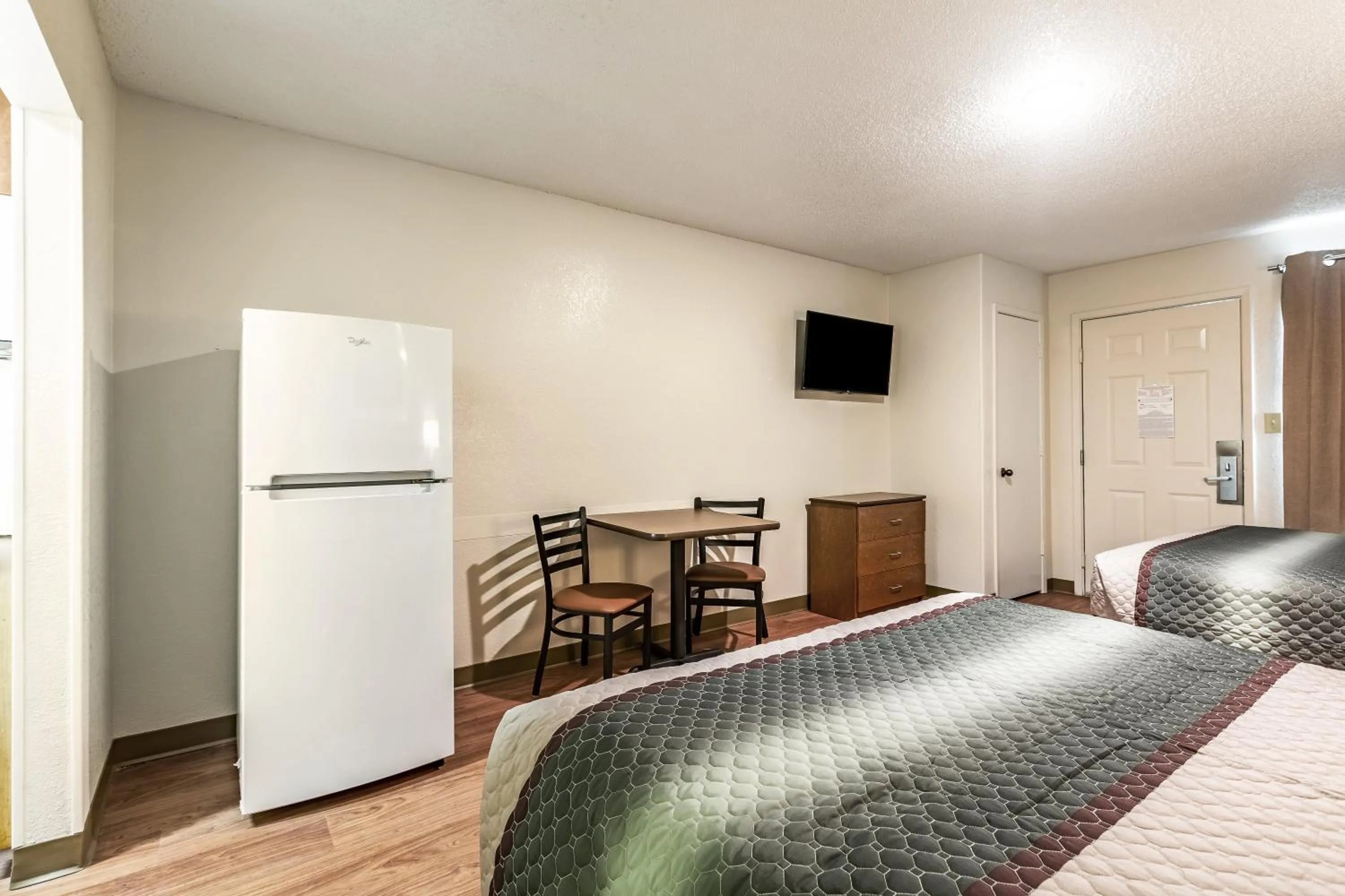 Photo of the whole room, Bed in HomeTowne Studios by Red Roof Atlanta NE - Downtown Norcross