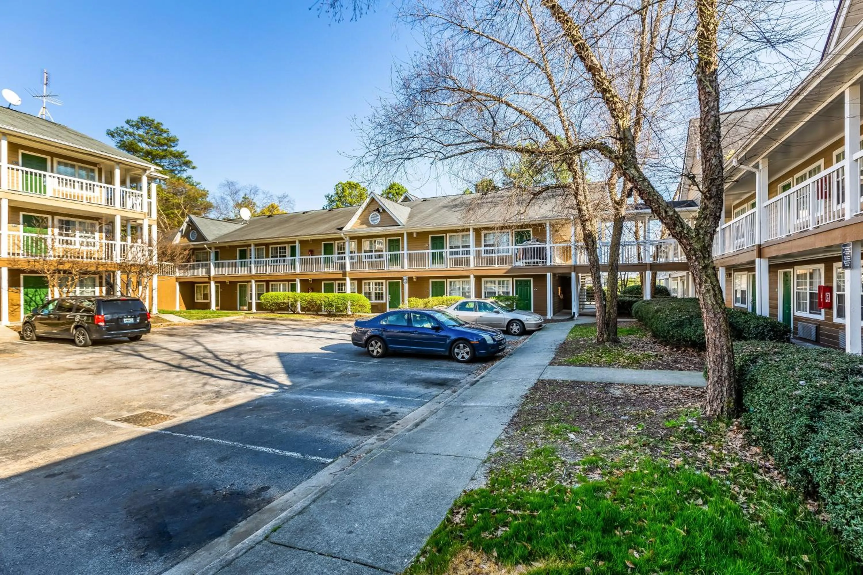 Property building in HomeTowne Studios by Red Roof Atlanta NE - Downtown Norcross