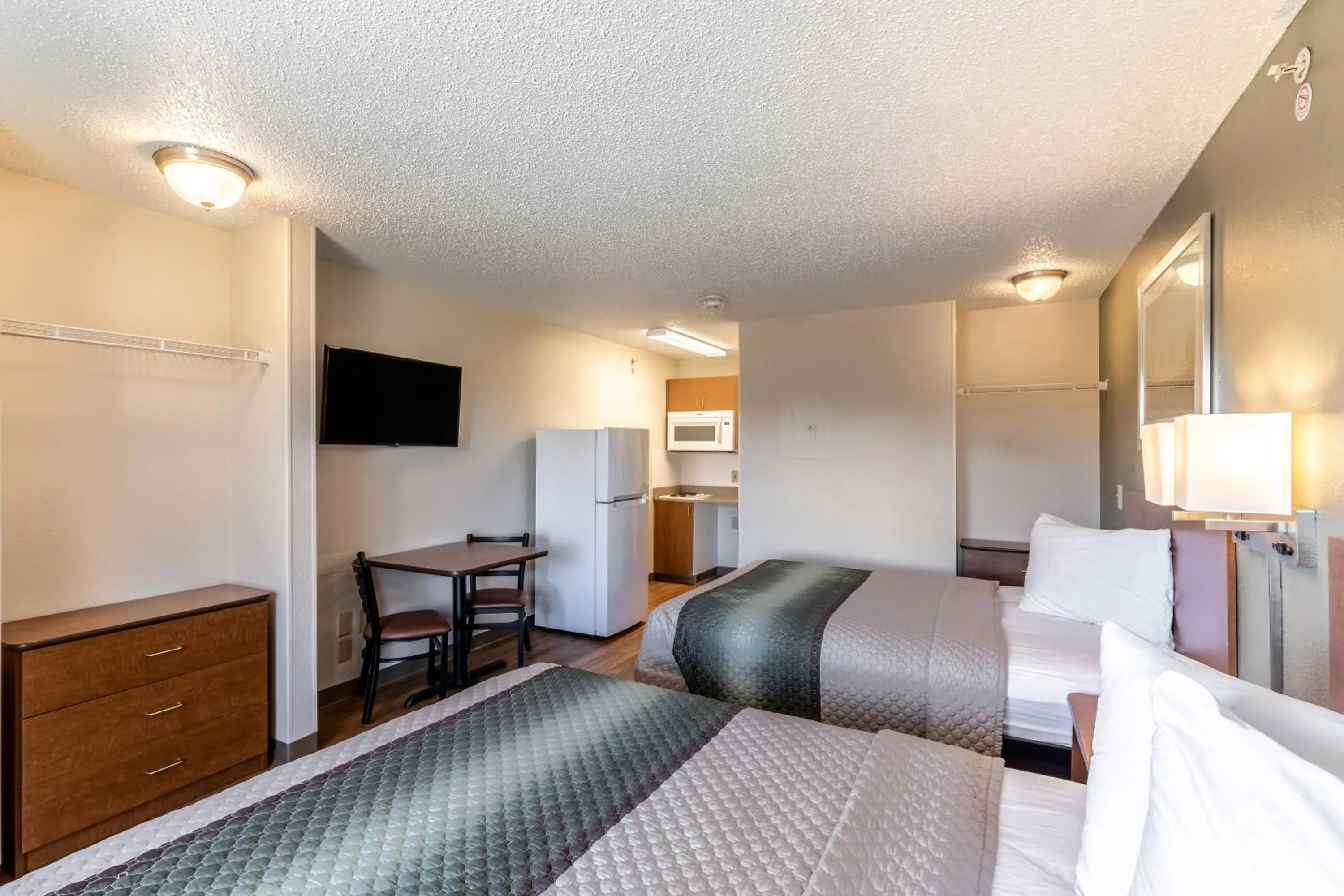 Photo of the whole room, Bed in HomeTowne Studios by Red Roof Austin