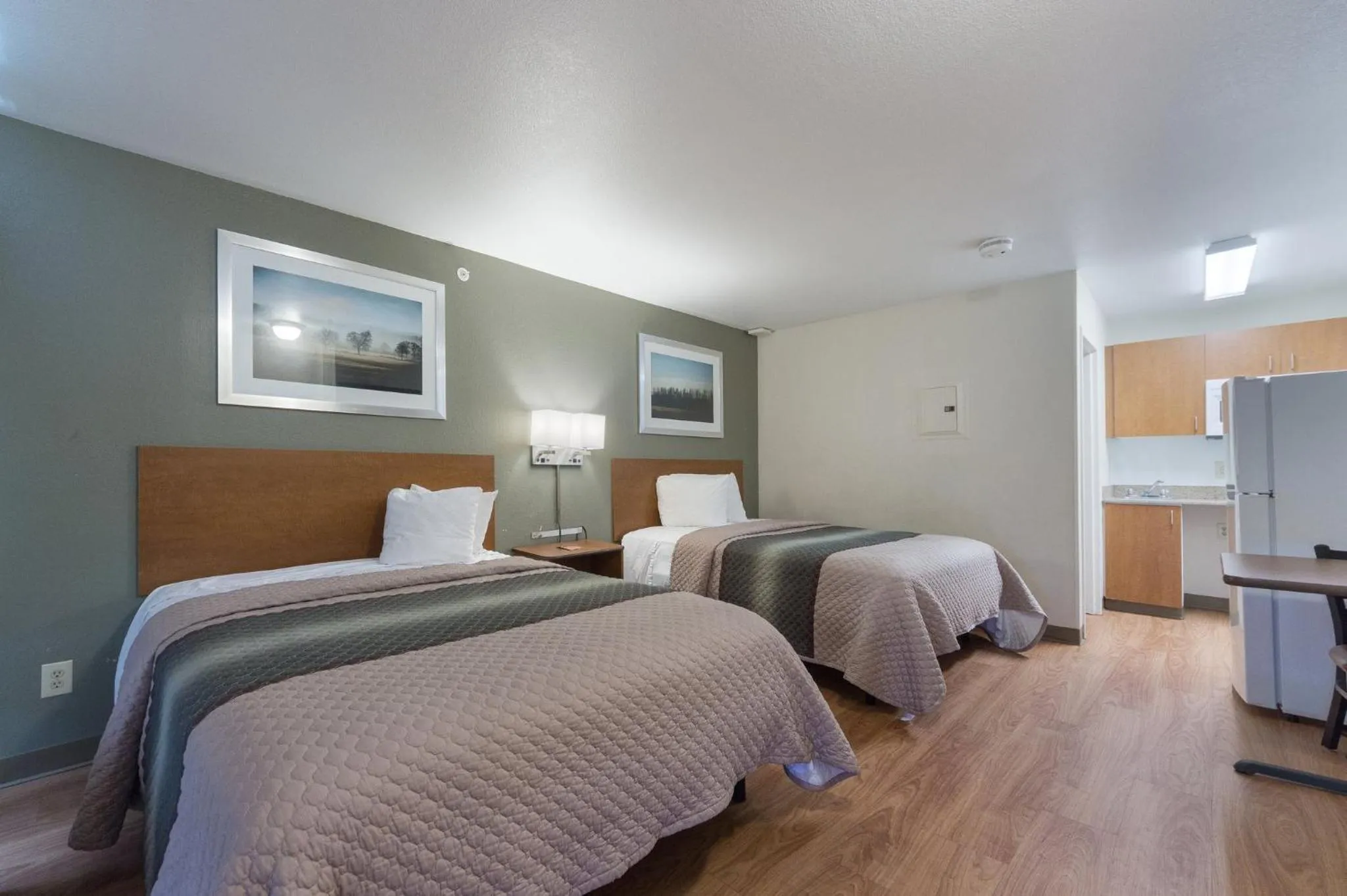 Bedroom, Bed in HomeTowne Studios by Red Roof Dallas - Irving