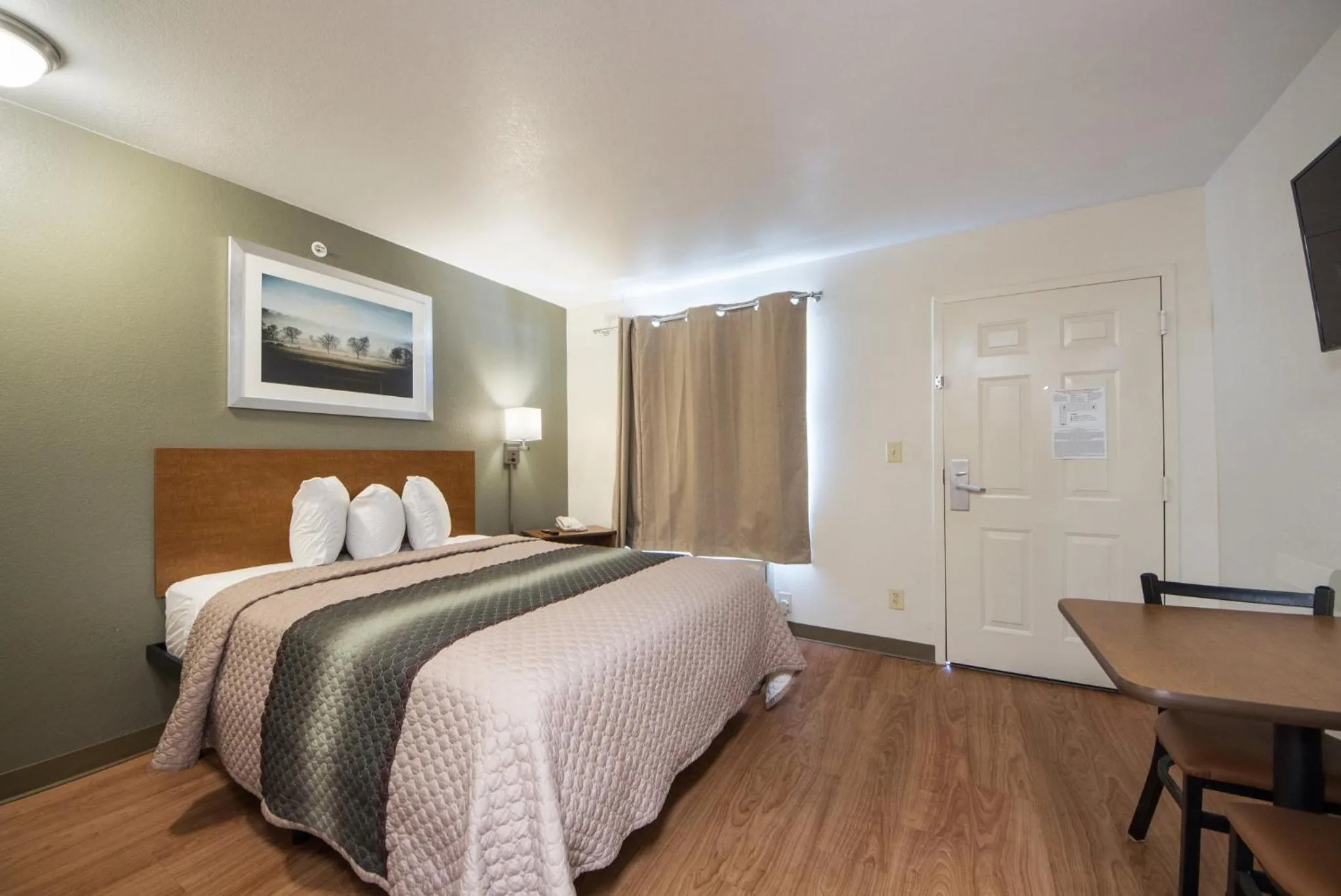 Bedroom, Bed in HomeTowne Studios by Red Roof Dallas - Irving