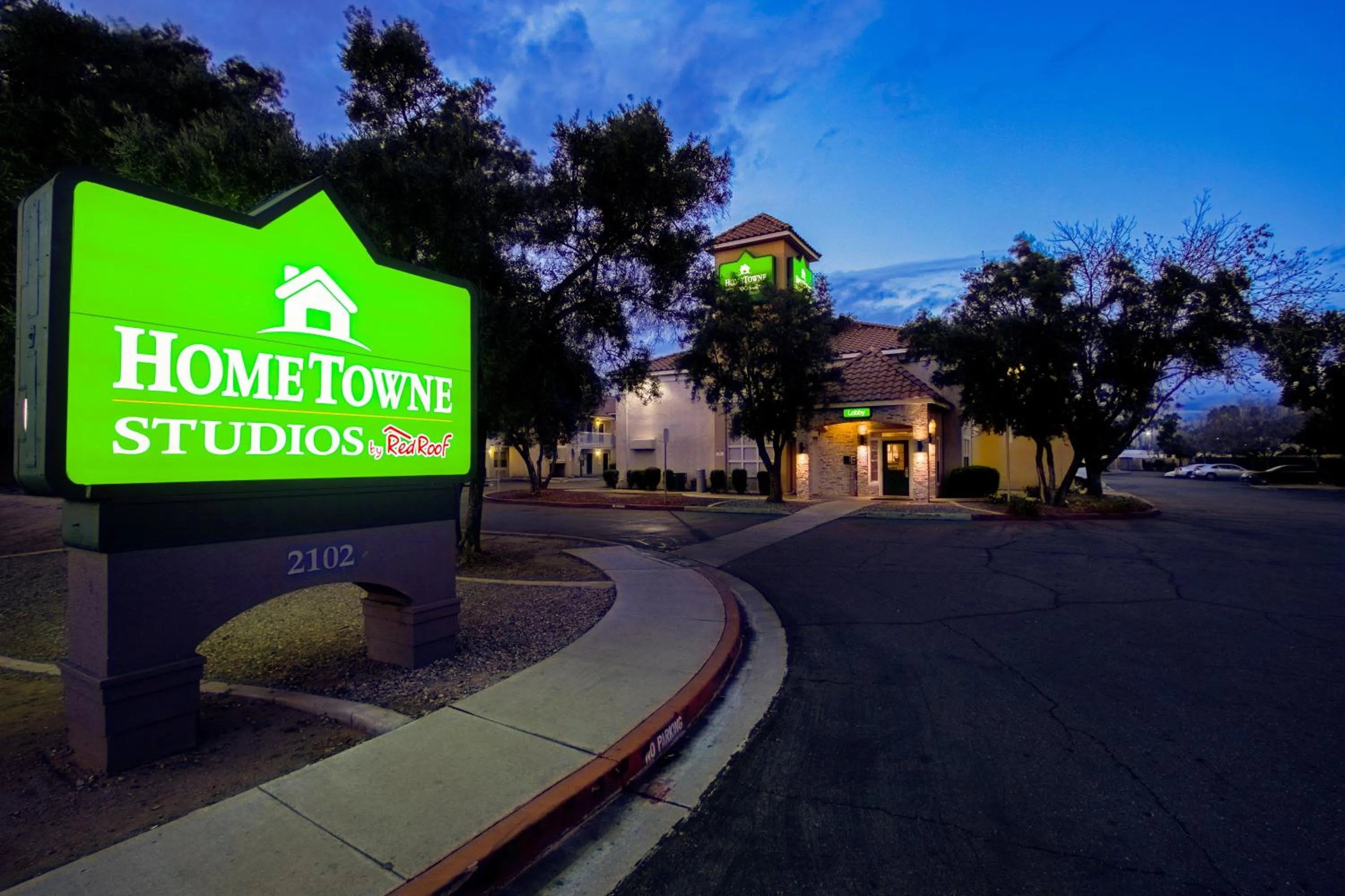 Property building in HomeTowne Studios by Red Roof Phoenix - Dunlap Ave