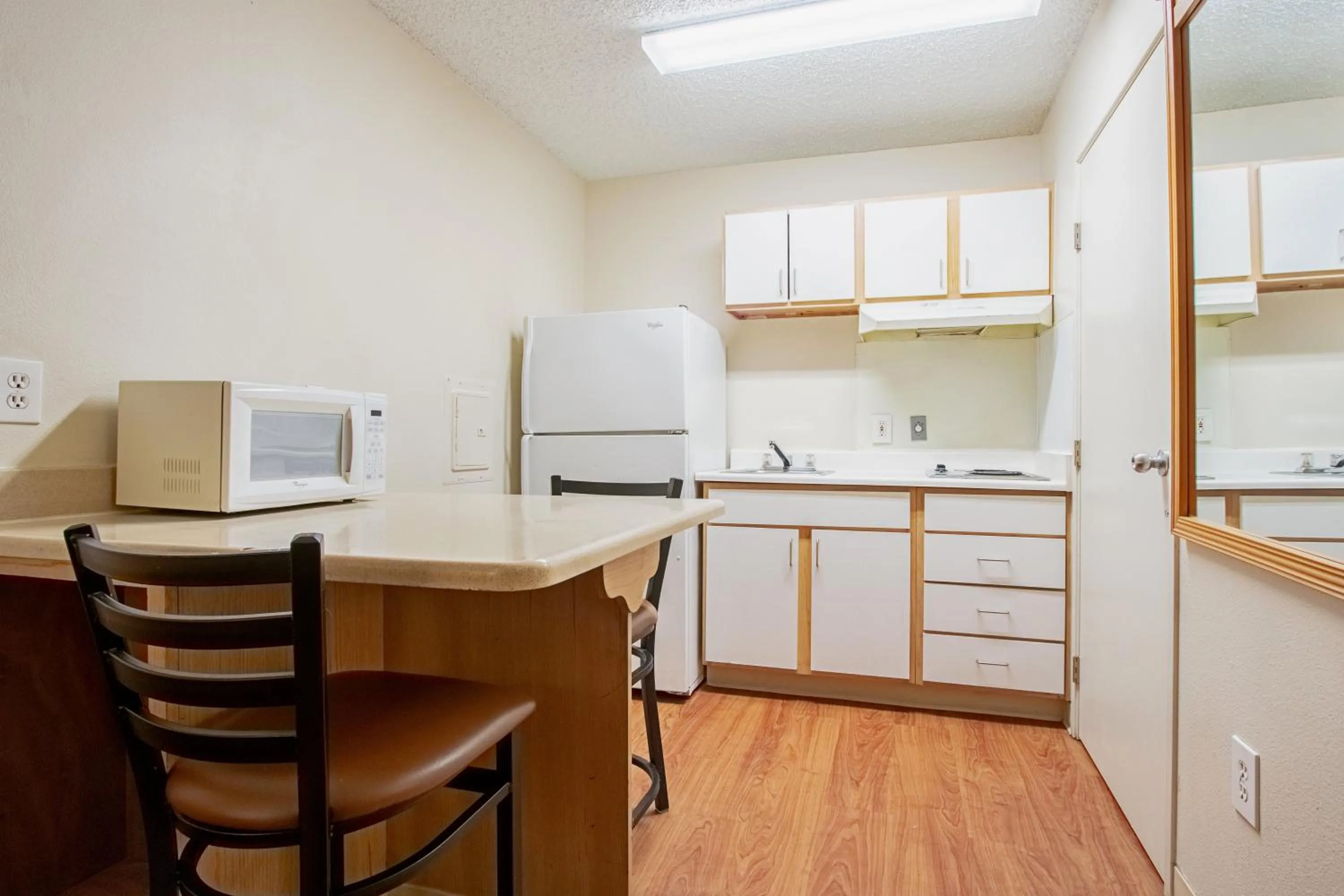 Photo of the whole room in HomeTowne Studios by Red Roof Phoenix - Dunlap Ave