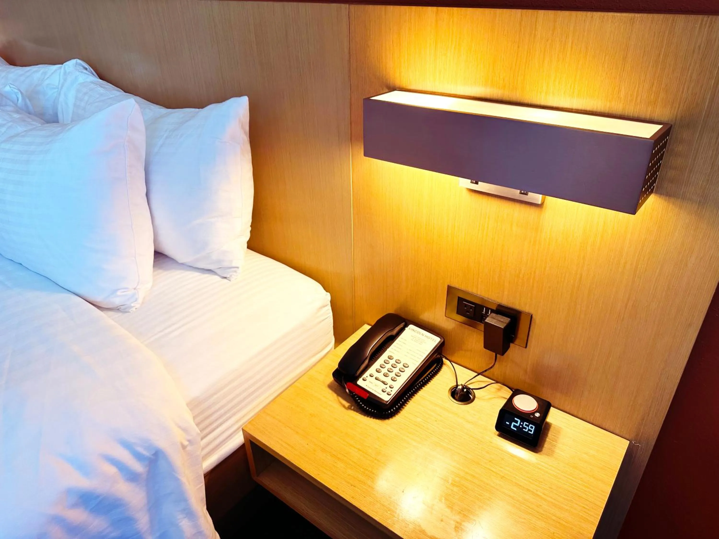 Bed in Lincoln Hotel Monterey Park Los Angeles