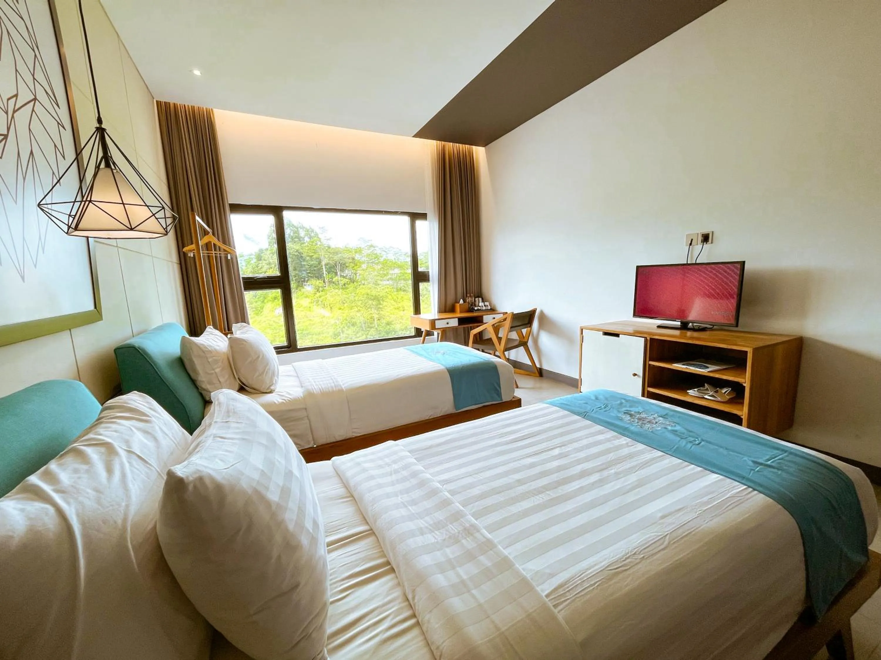 Bed in Hotel Dafam Wonosobo