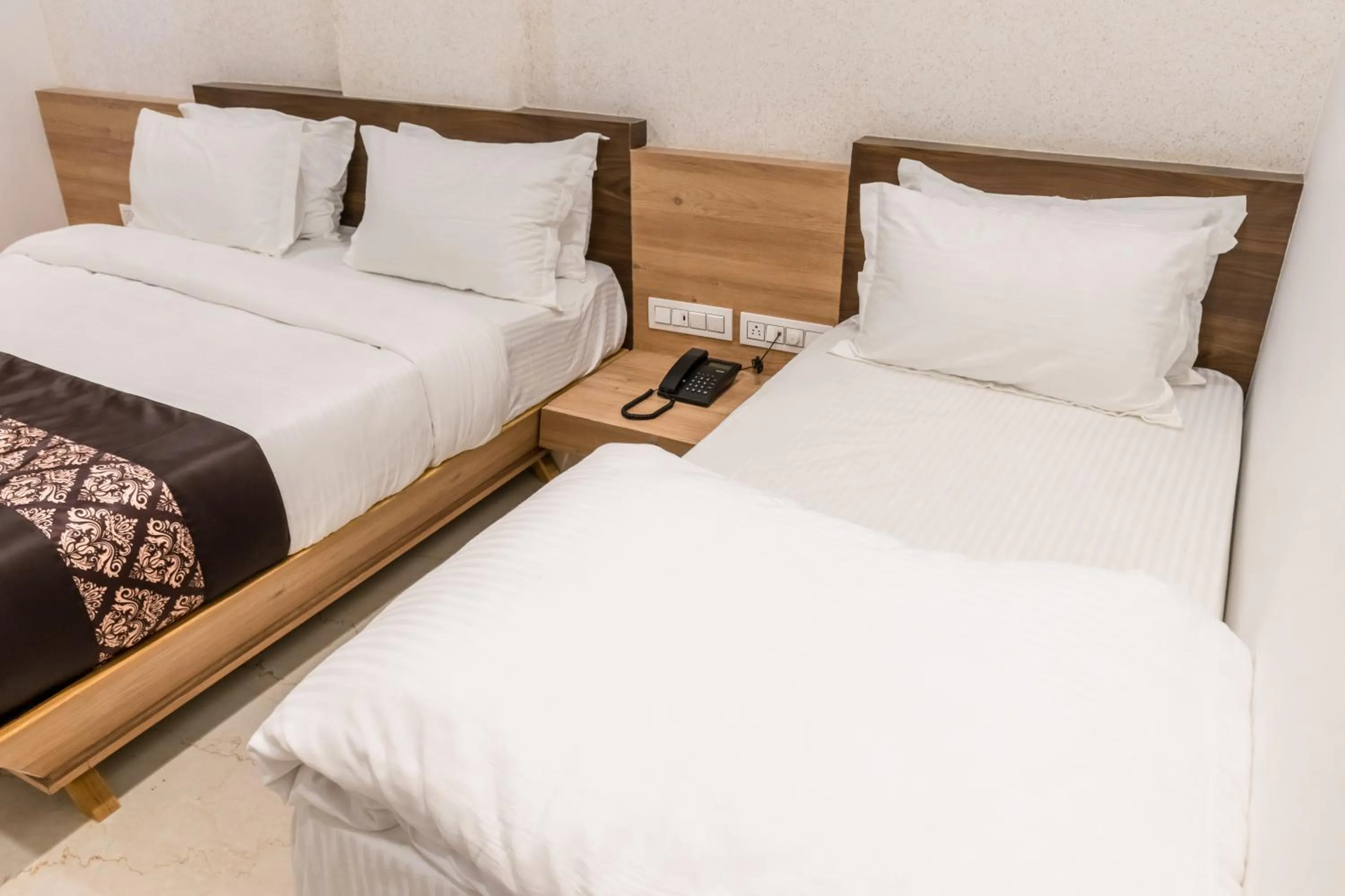 Bed in Meridian Hotel & Banquet