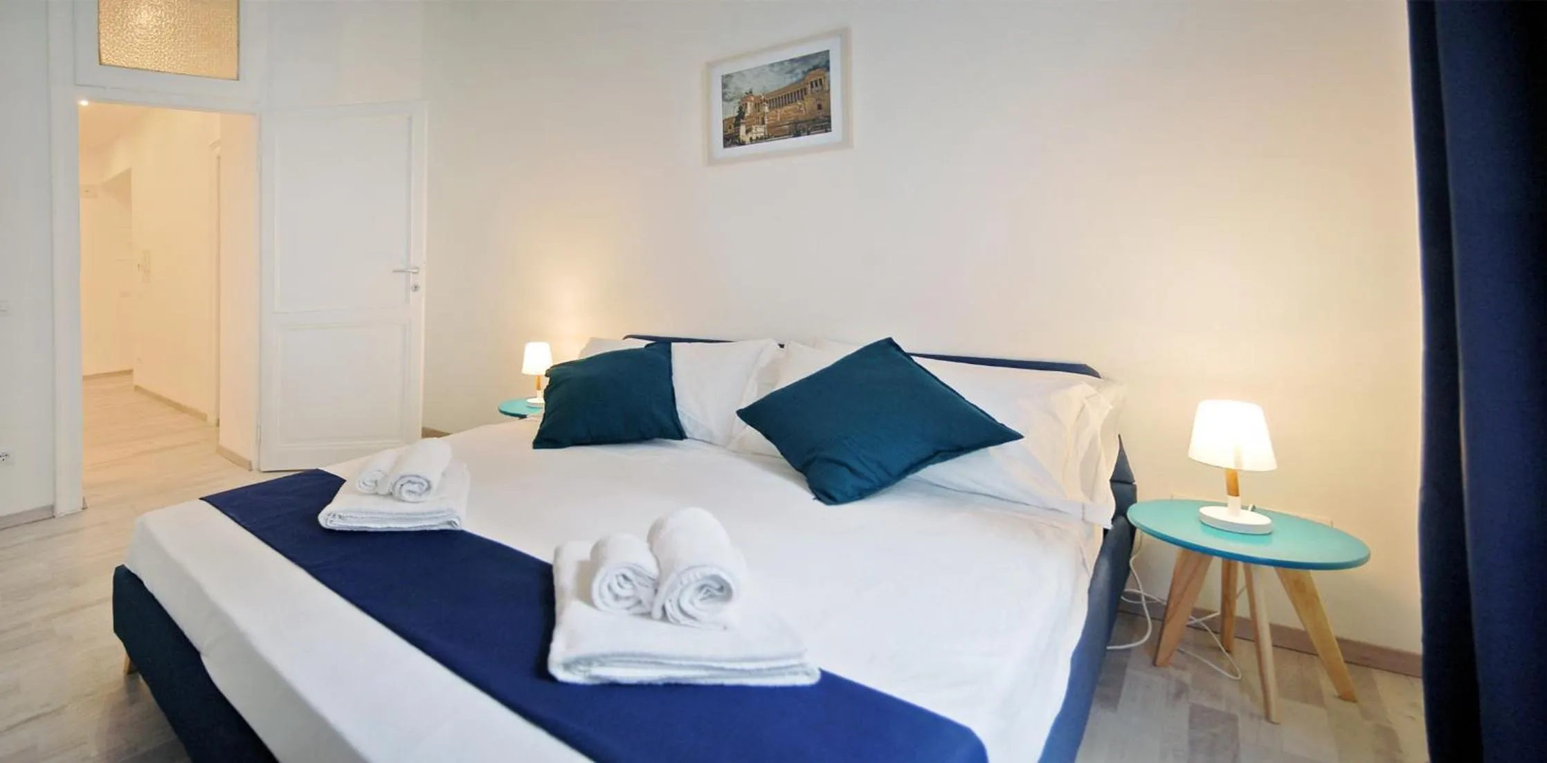 Bed in Pompeo Magno White Luxury Apartment