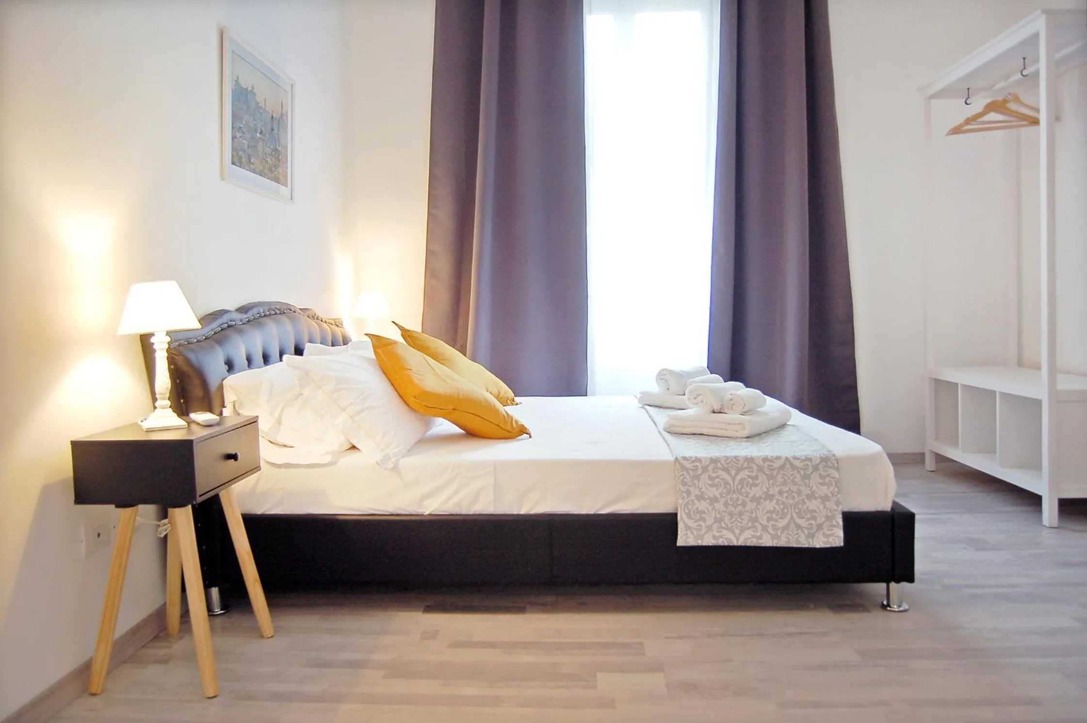 Bed in Pompeo Magno White Luxury Apartment