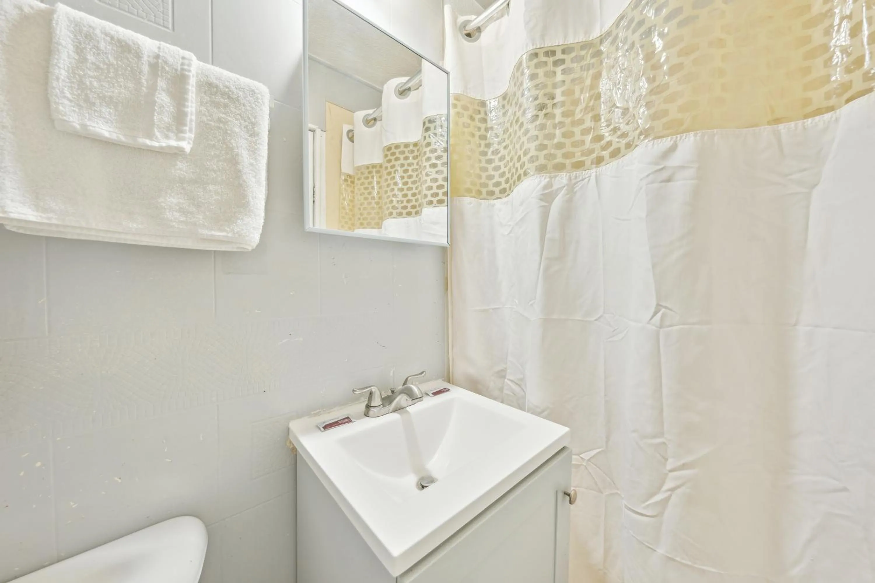 Bathroom in Flint Motel by OYO MI Near I-475