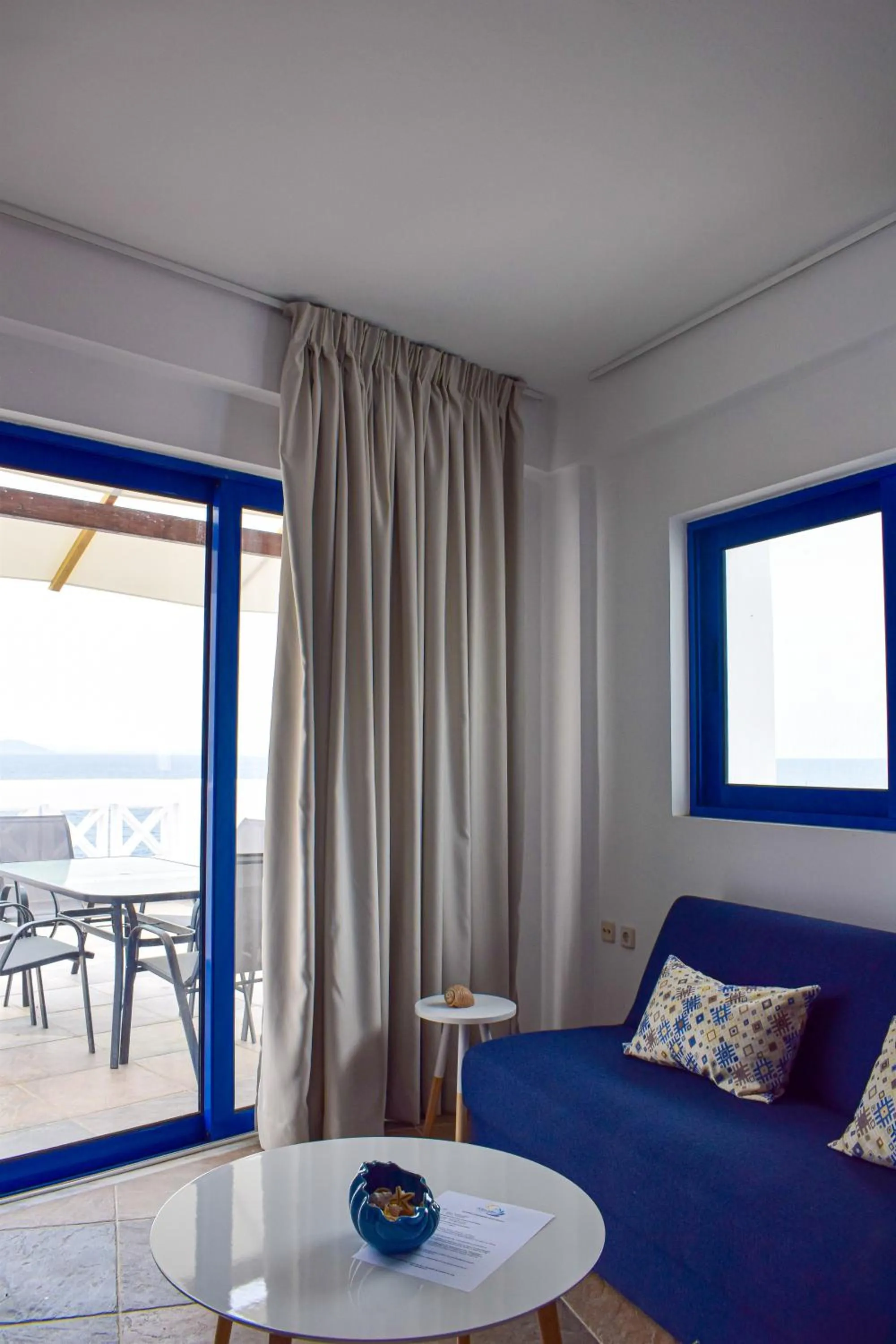 Living room, Bed in Muses seaside Villas