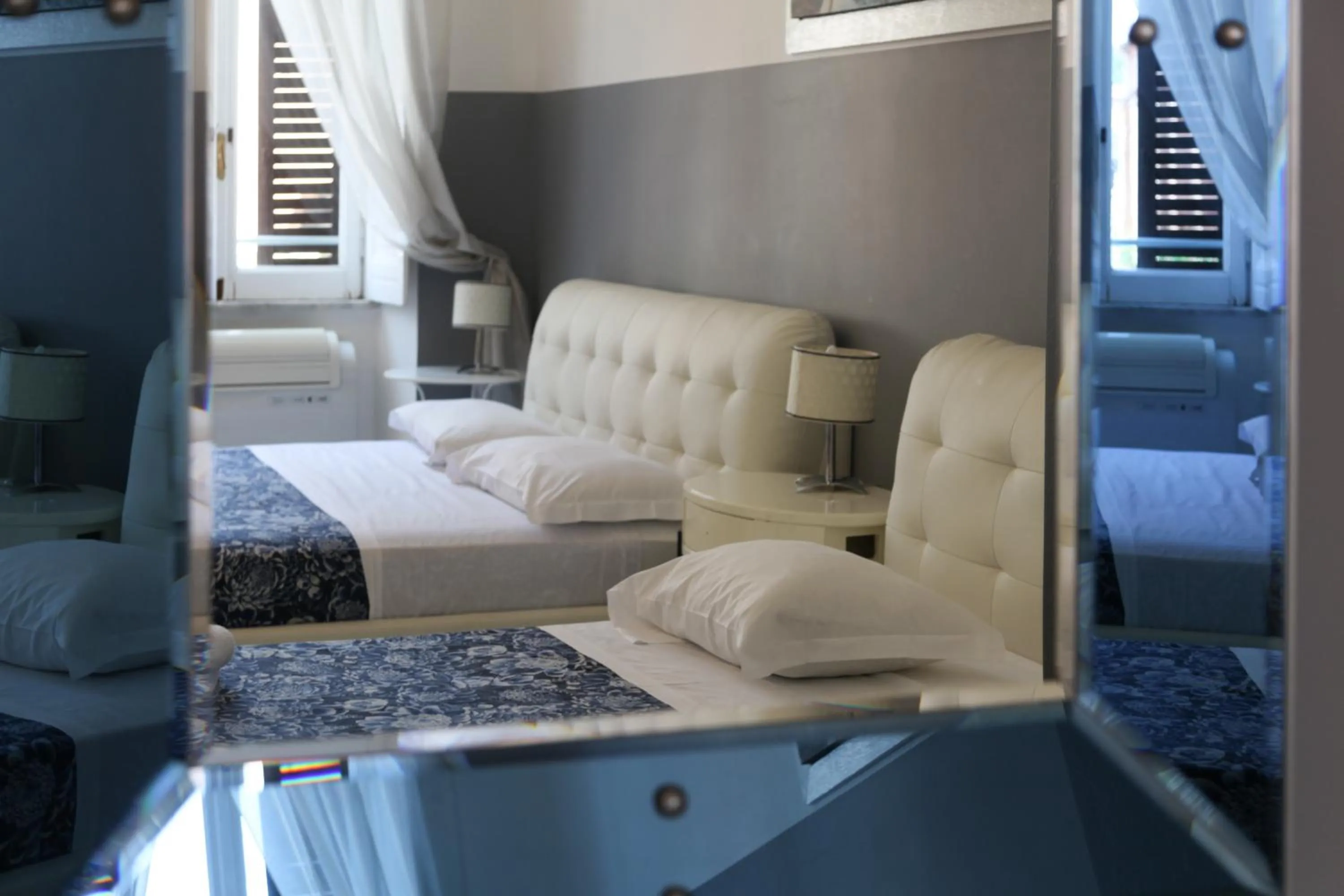 Photo of the whole room, Bed in Vatican Room and Kitchen