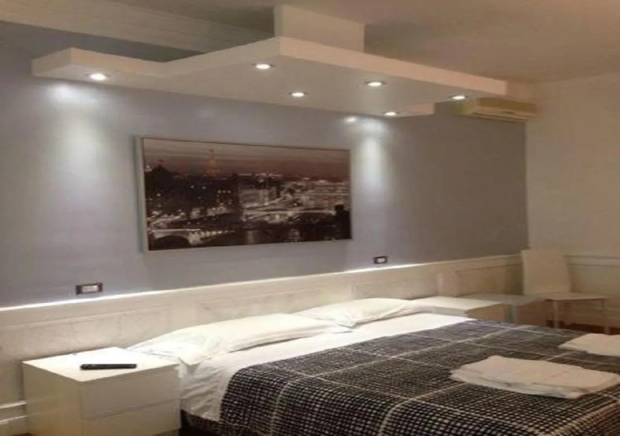 Photo of the whole room, Bed in Vatican Room and Kitchen