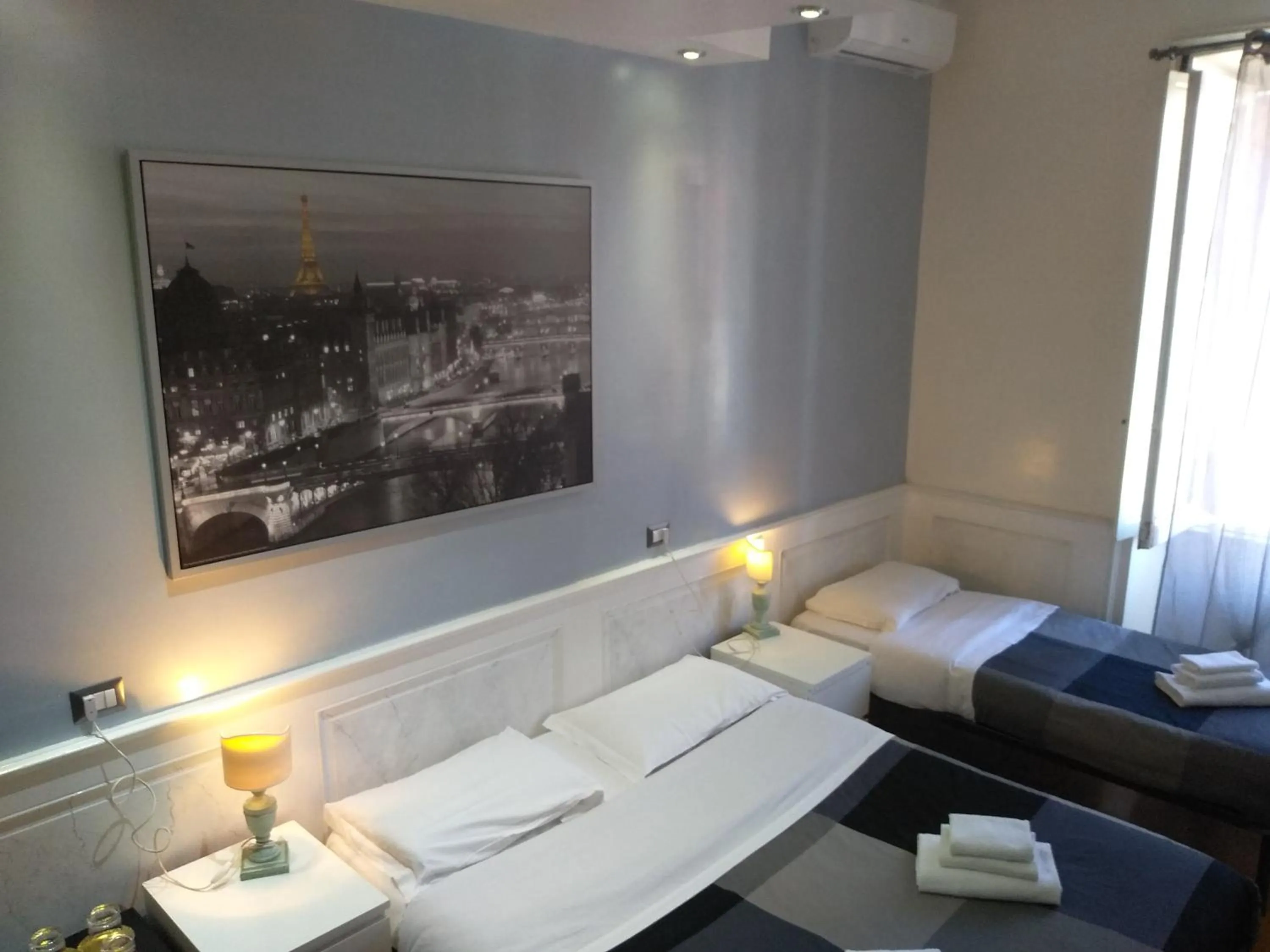 Photo of the whole room, Bed in Vatican Room and Kitchen