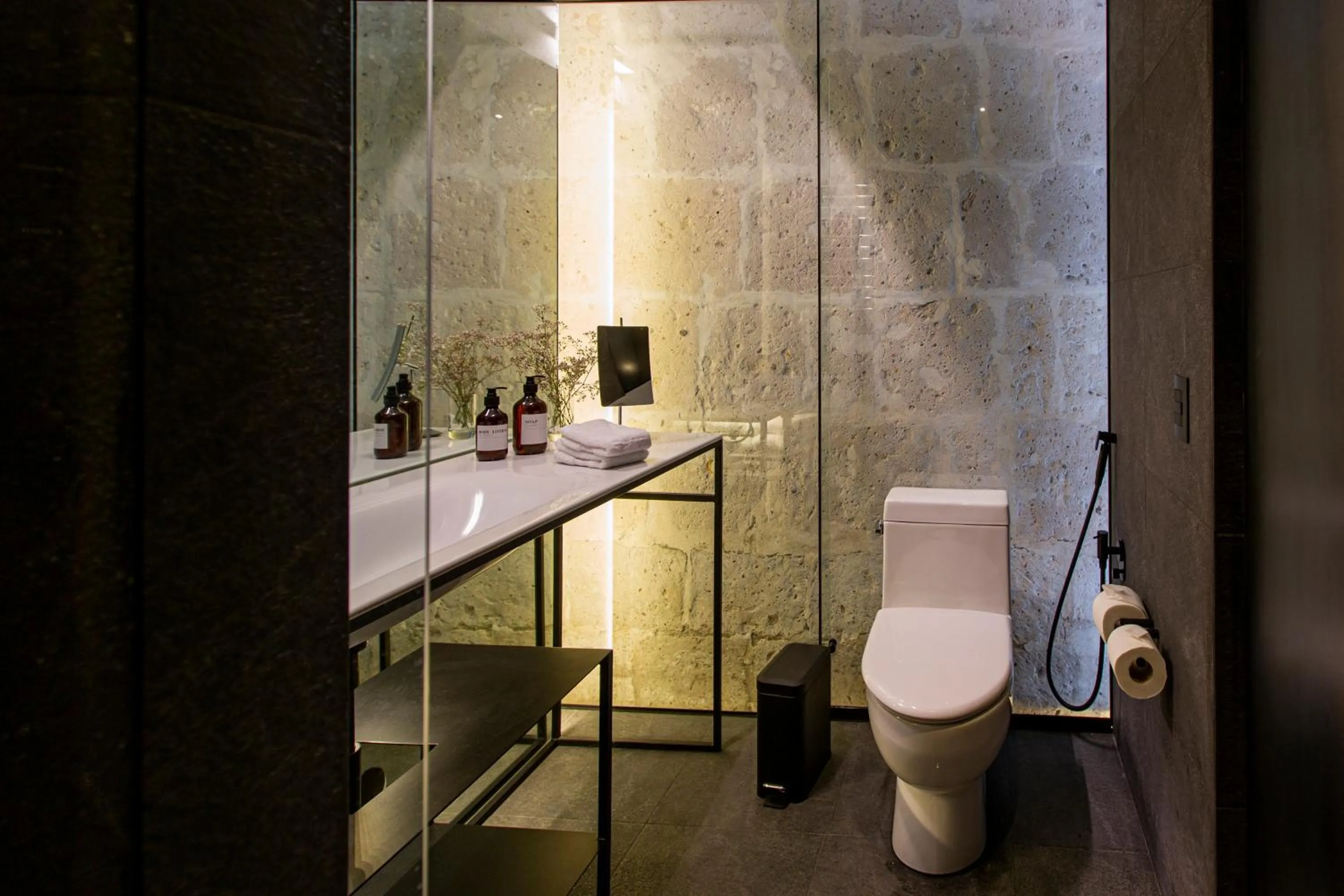 Bathroom in CIRQA - Relais & Châteaux