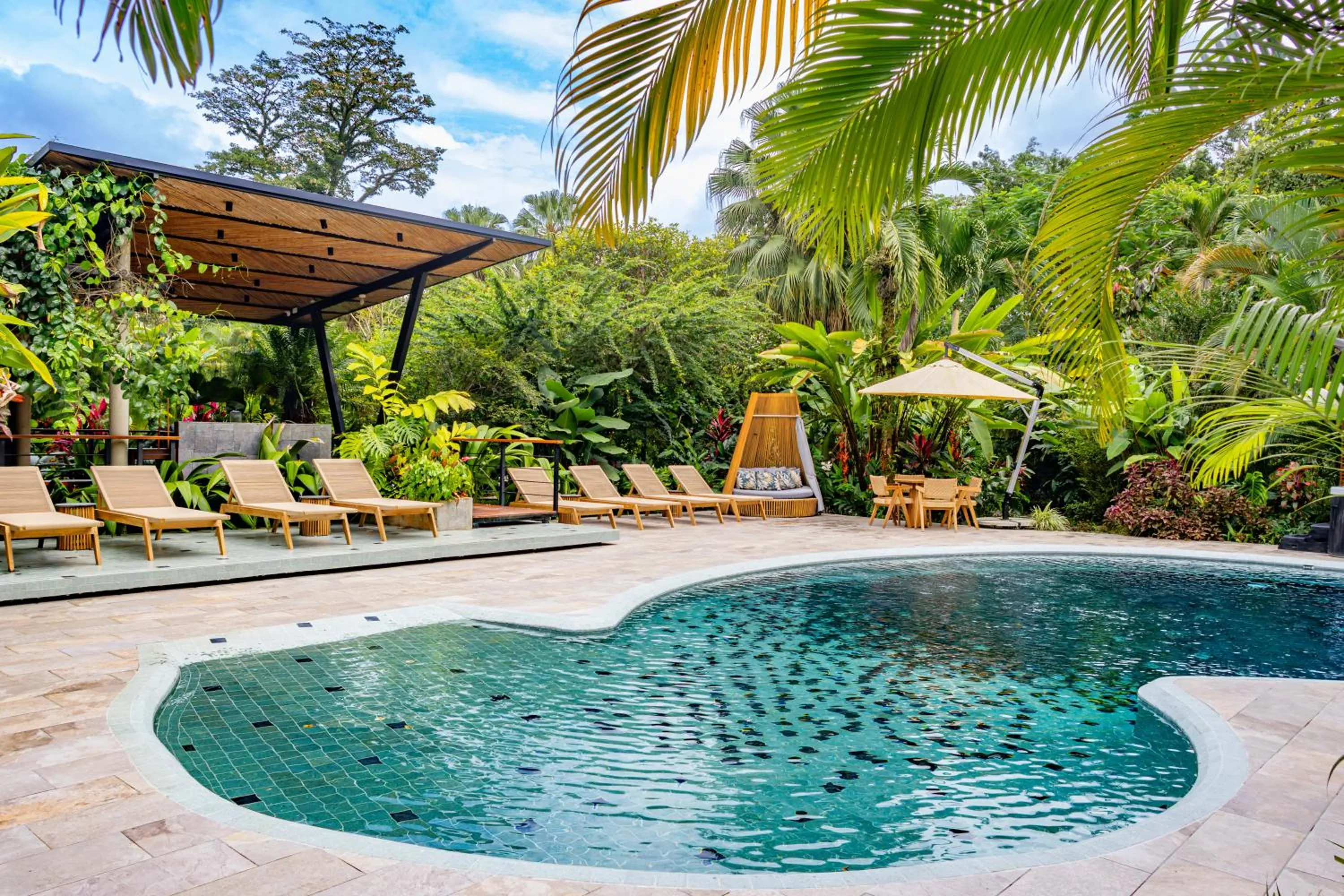 Swimming pool in Noah's Forest Hotel by Tifakara