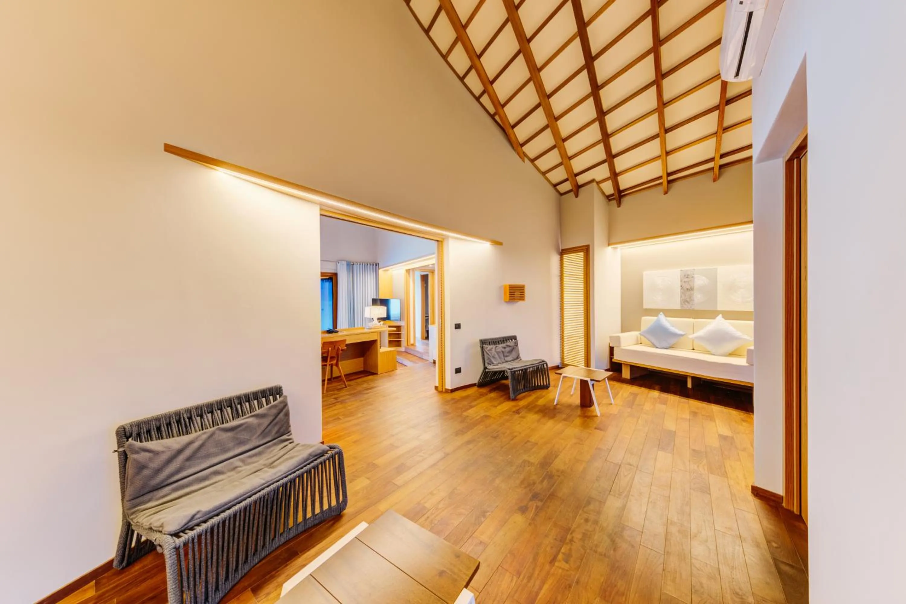 Seating area, Bed in Cinnamon Velifushi Maldives