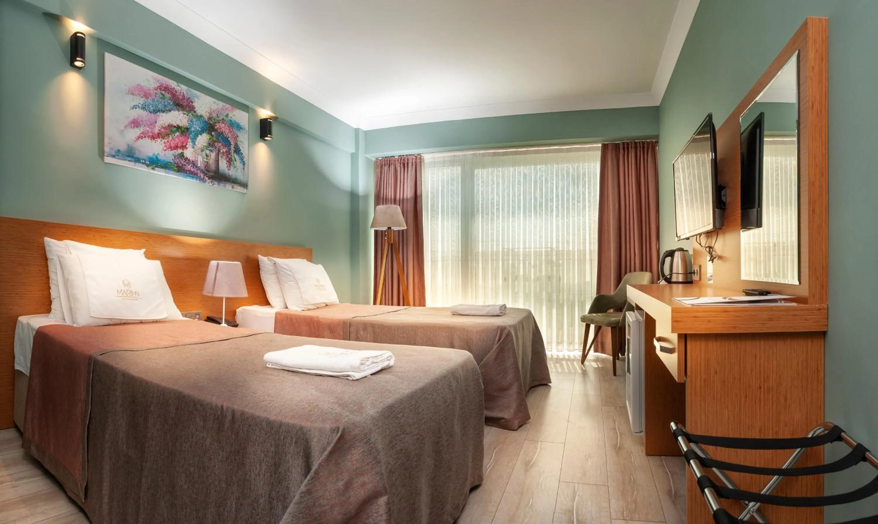 Bed in MARINN DELUXE HOTEL