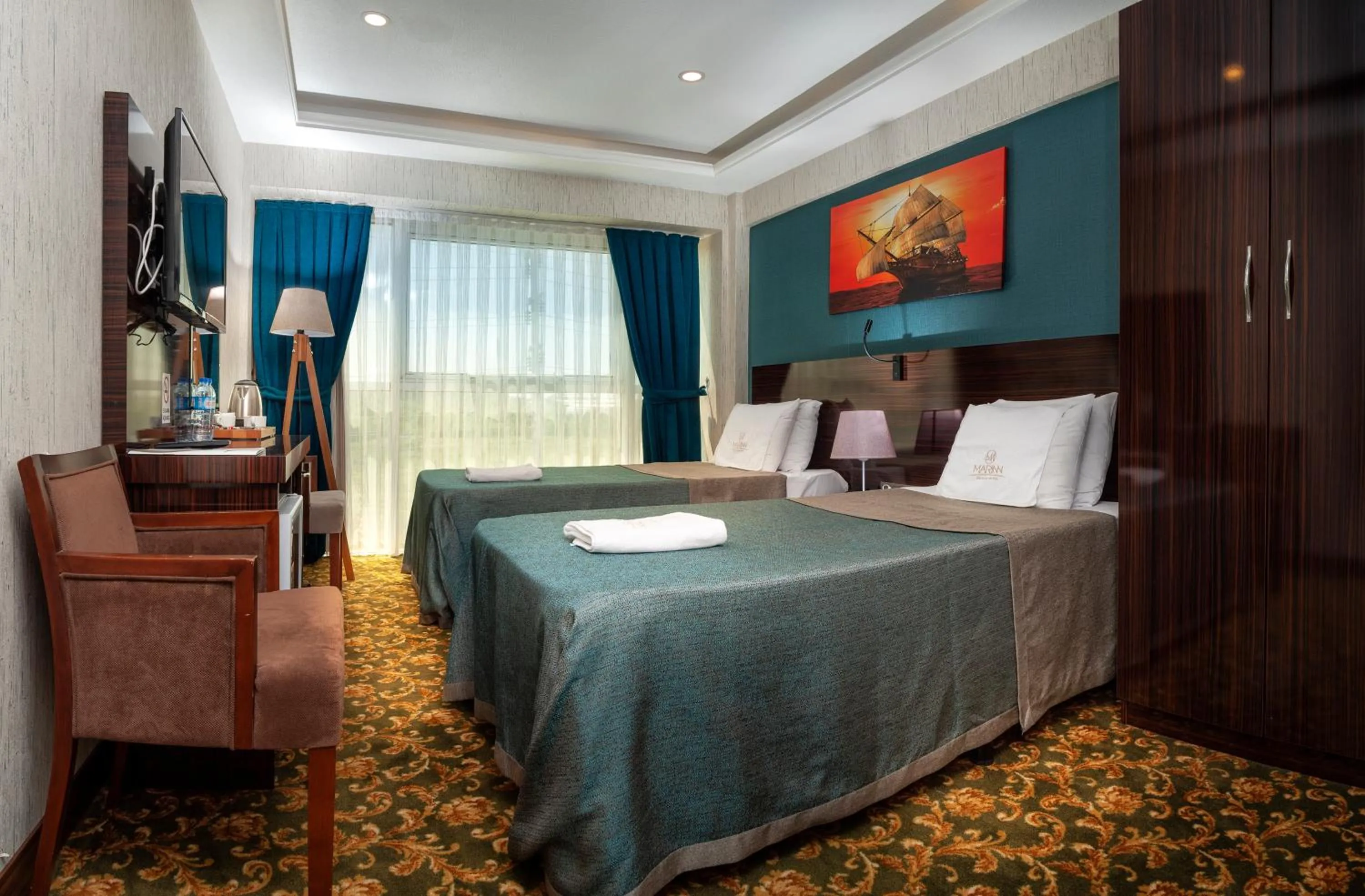 Bed in MARINN DELUXE HOTEL