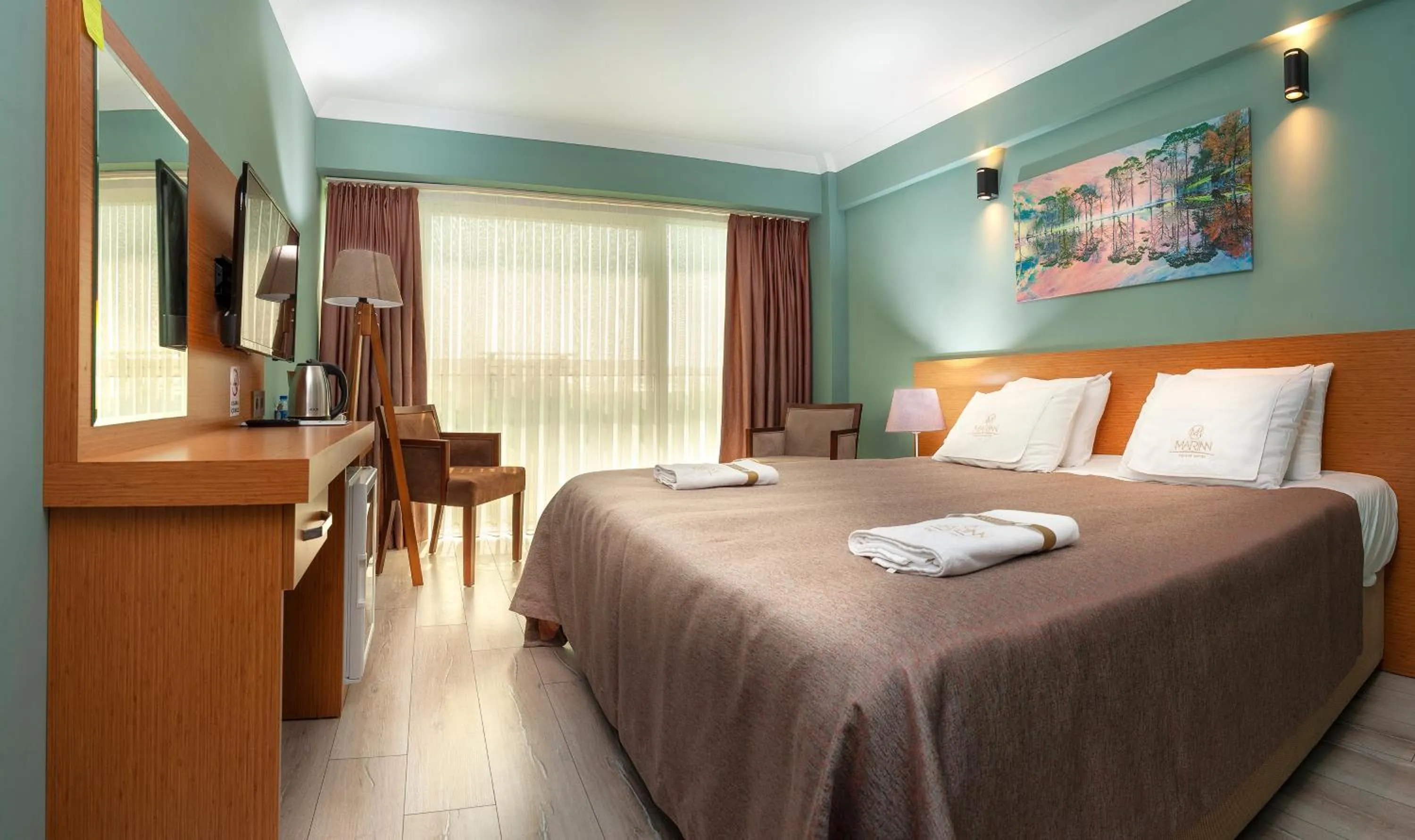 Bed in MARINN DELUXE HOTEL