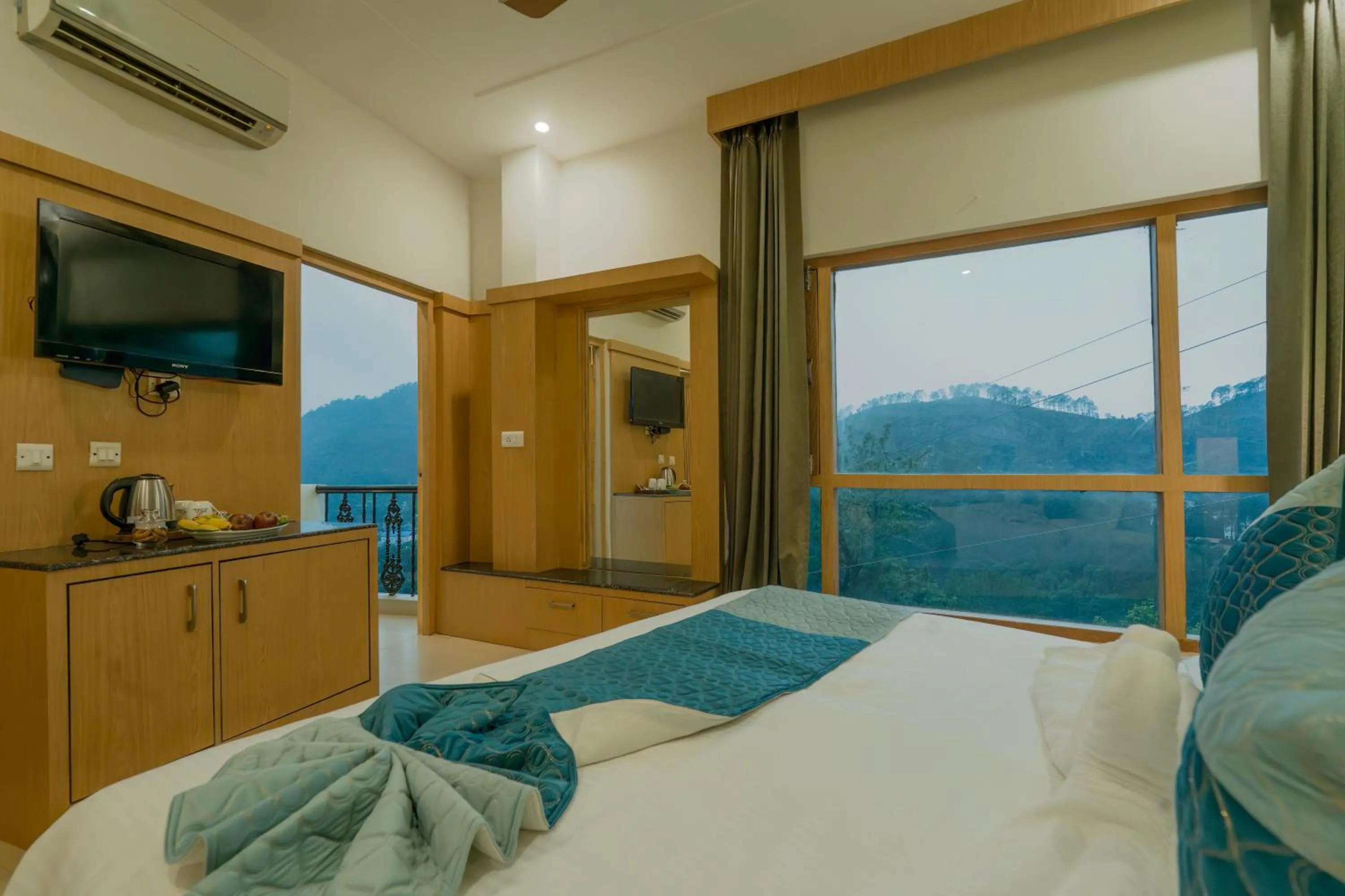 View (from property/room), Bed in Excel Hotels and Resorts Bhimtal