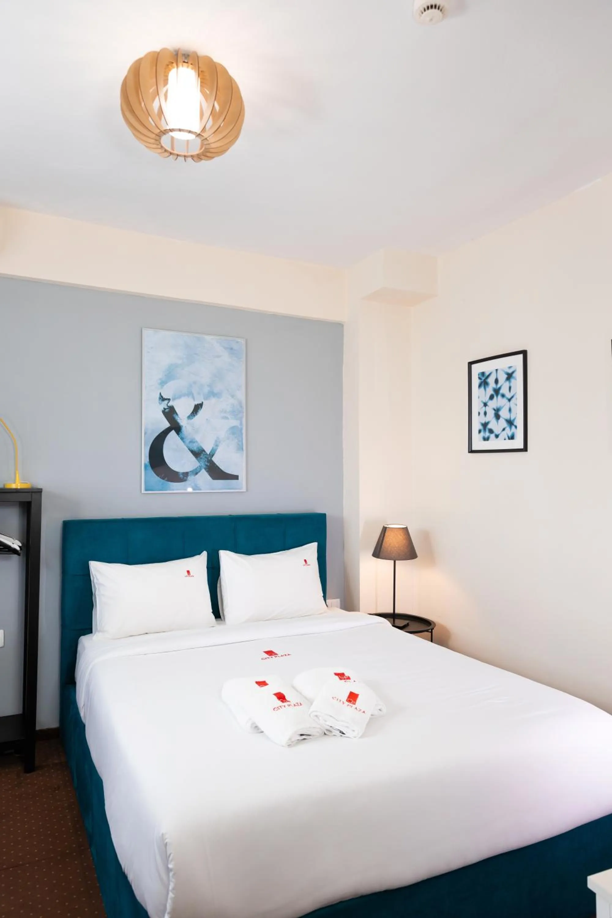 Bed in City Plaza Apartments & Rooms