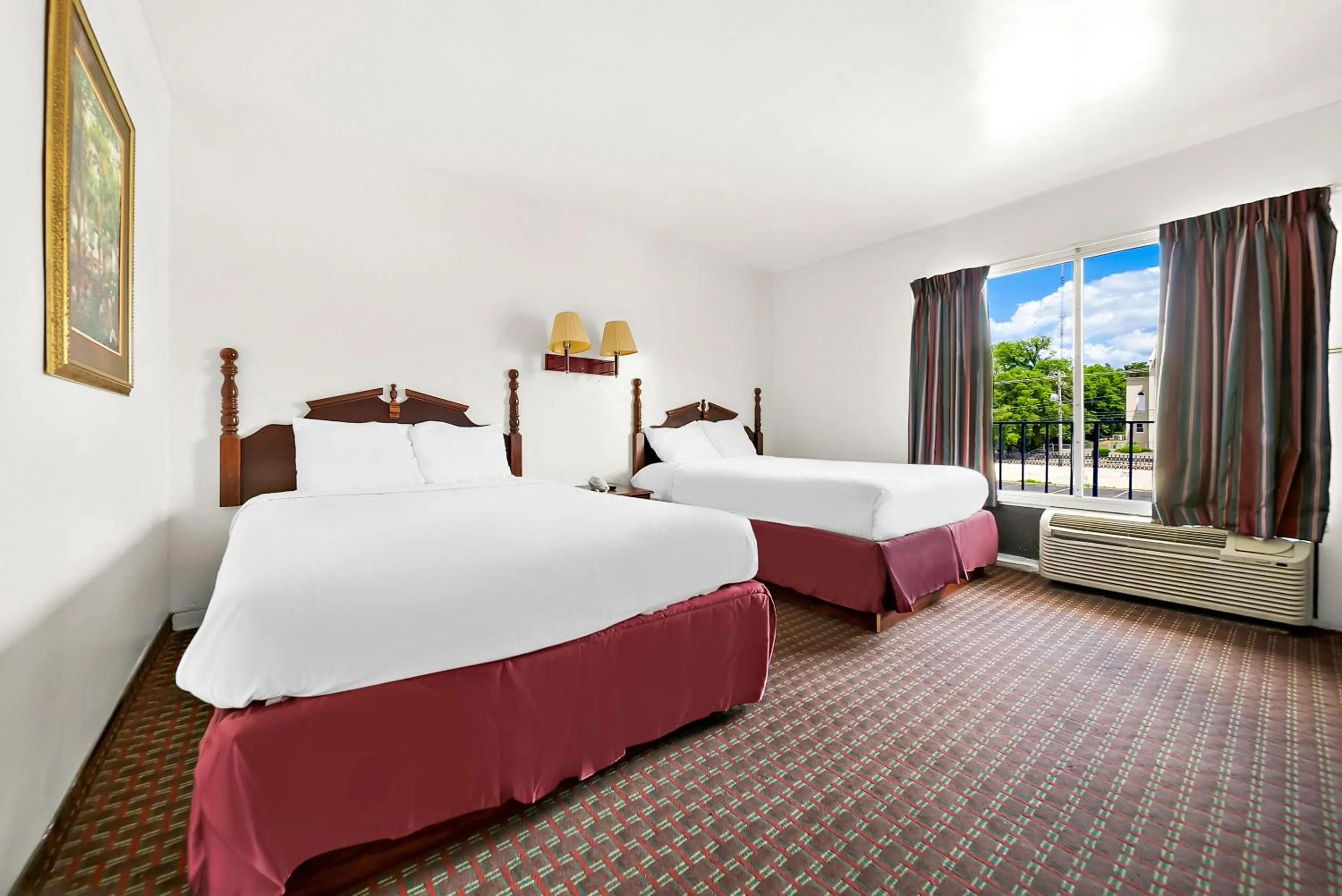 Bed in Capitol Inn and Suites