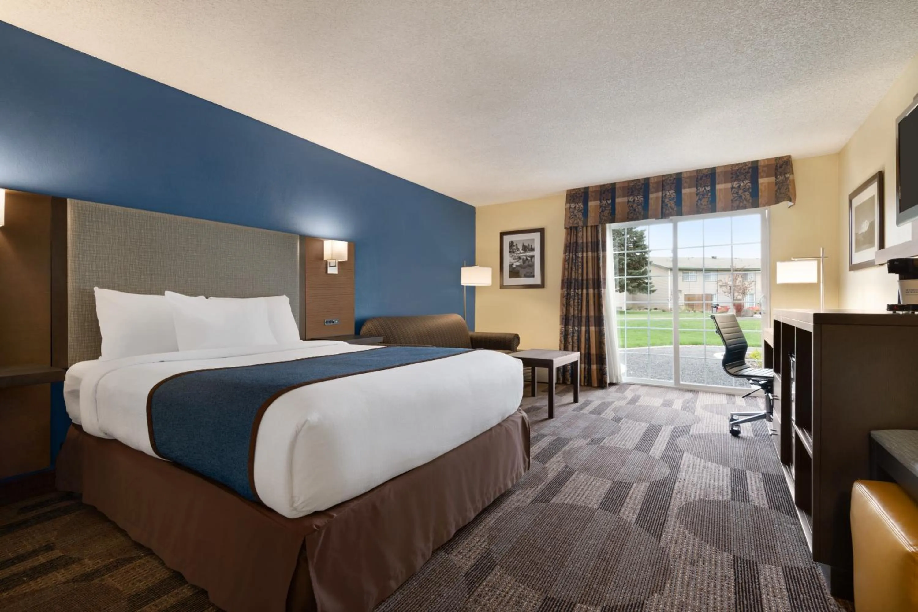 Bed in Ramada by Wyndham Spokane Airport
