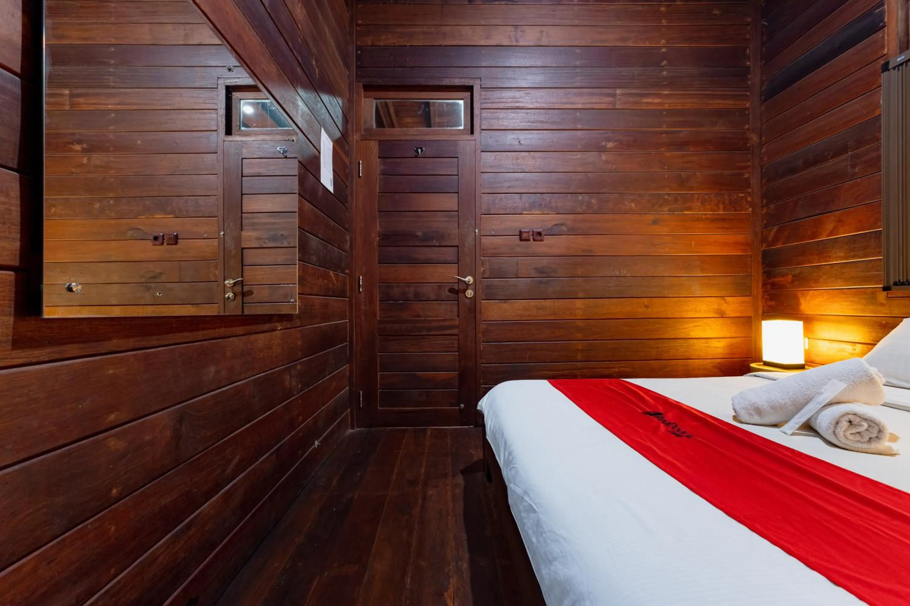 Bedroom, Bed in RedDoorz Resort @ Taman Wisata Mangrove