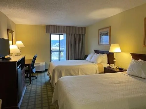 Bed in Days Inn & Suites by Wyndham Sutton Flatwoods