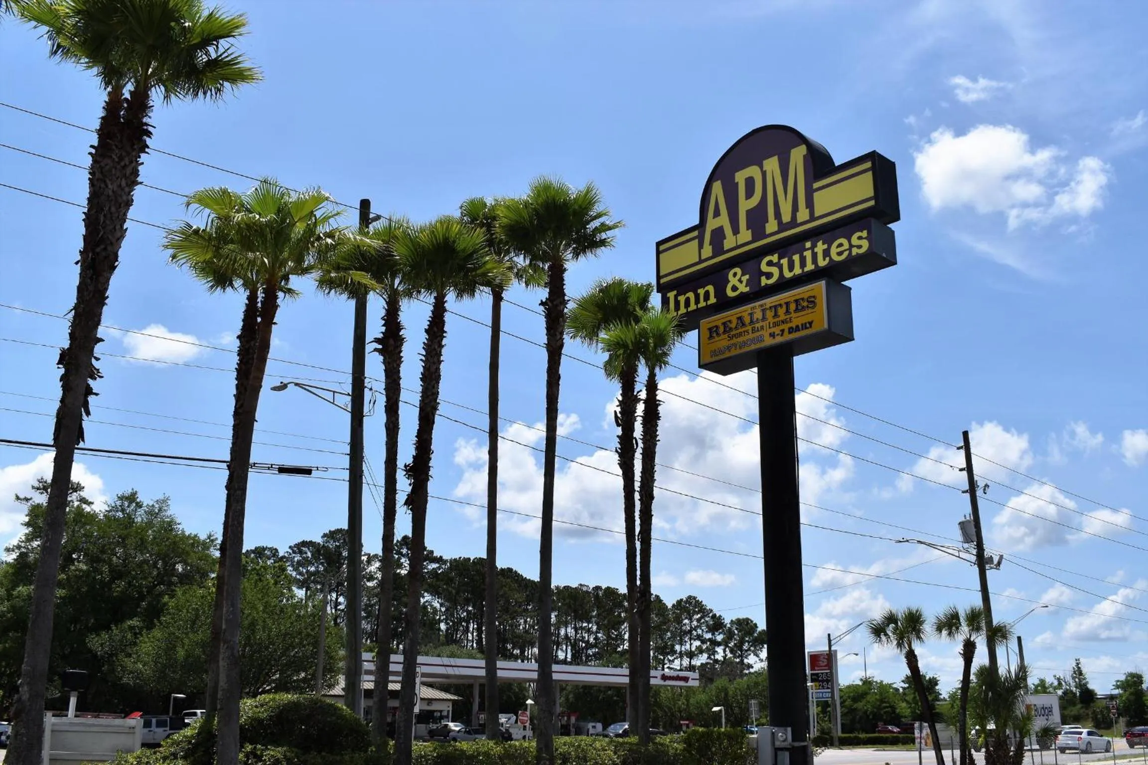 Property logo or sign in APM Inn & Suites - Jacksonville