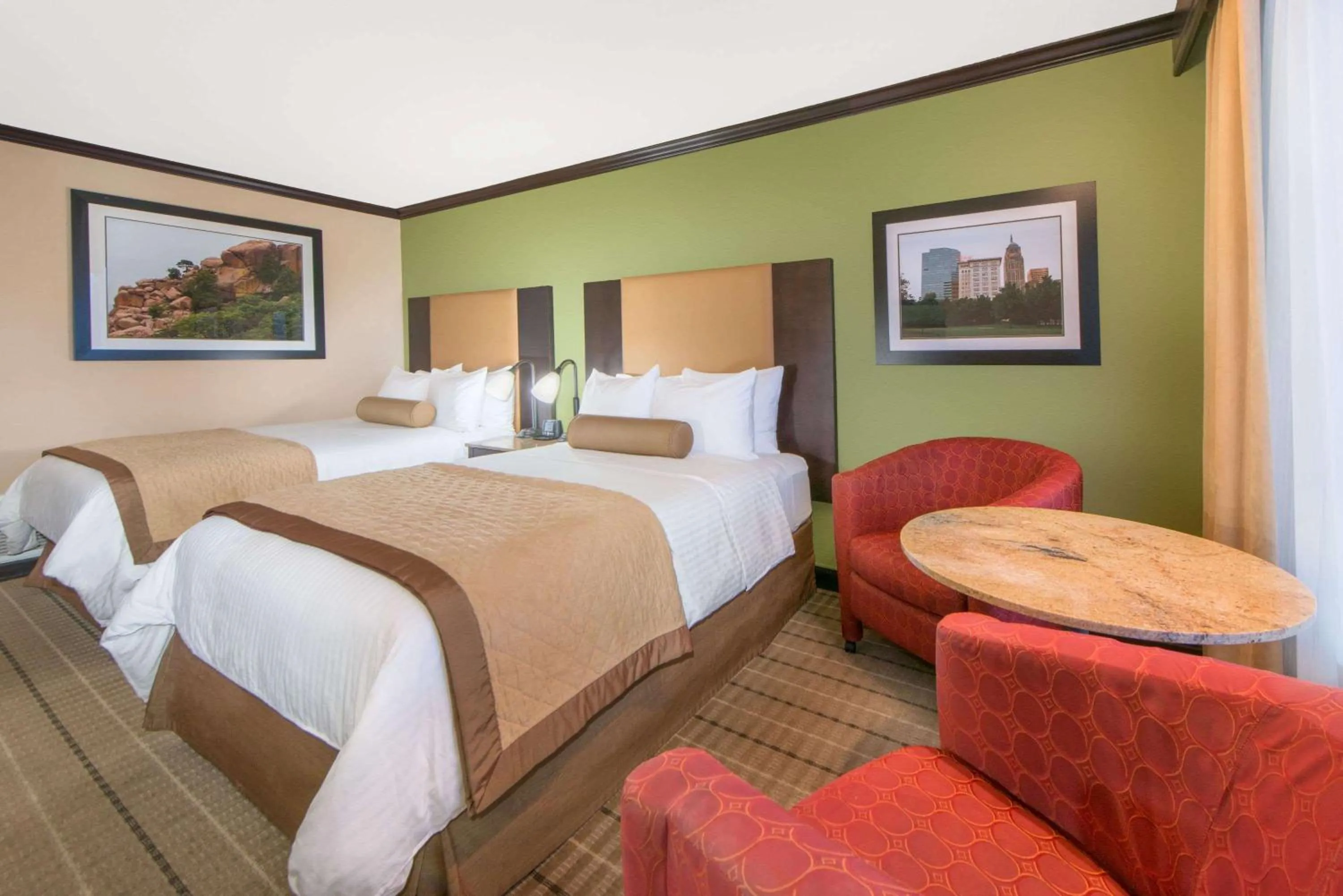 Photo of the whole room, Bed in Wyndham Garden Oklahoma City Resort & Conference Hotel Near Airport, Fairgrounds Paycom & I40