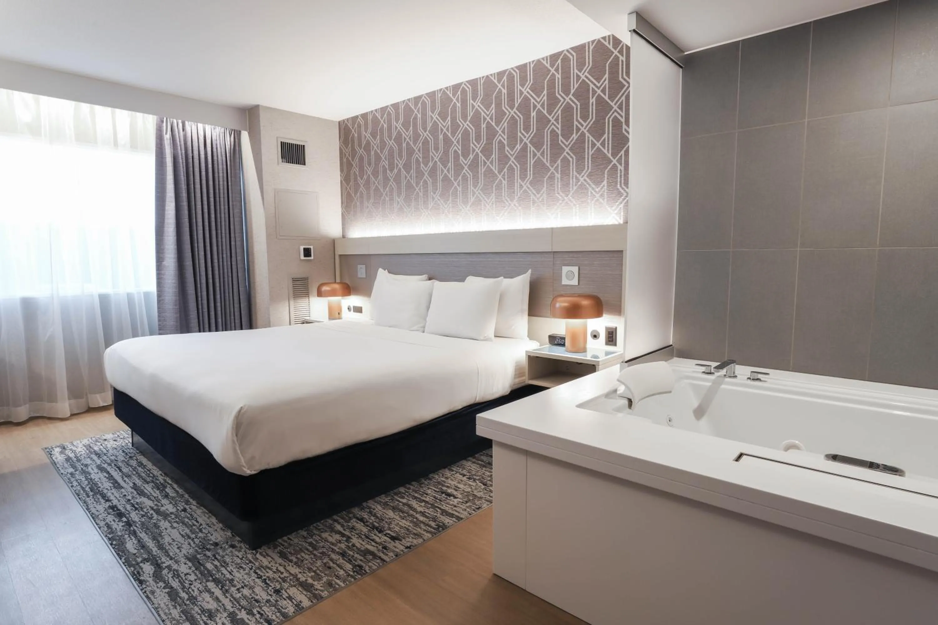 Bathroom, Bed in Radisson Plaza Hotel at Kalamazoo Center