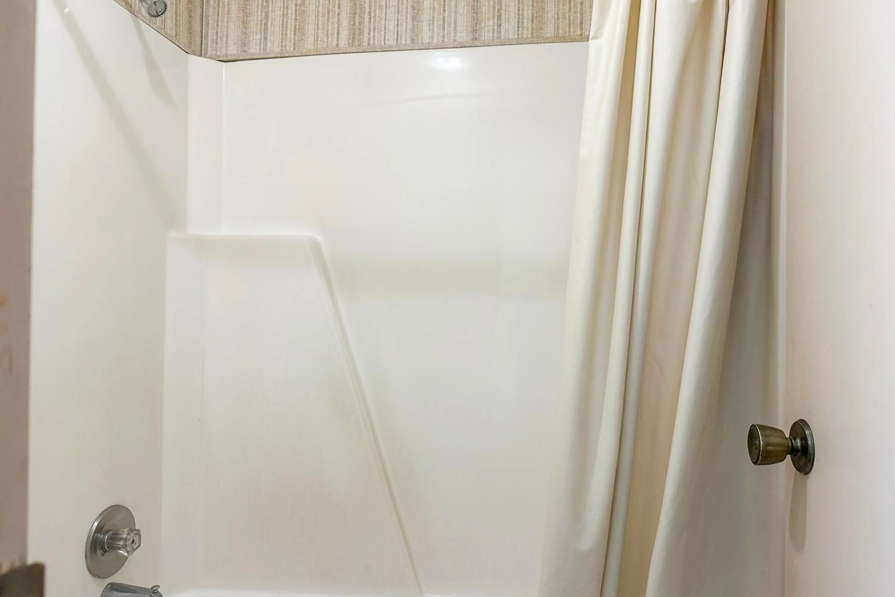 Bathroom in Louisville Inn by OYO Louisville Municipal Airport