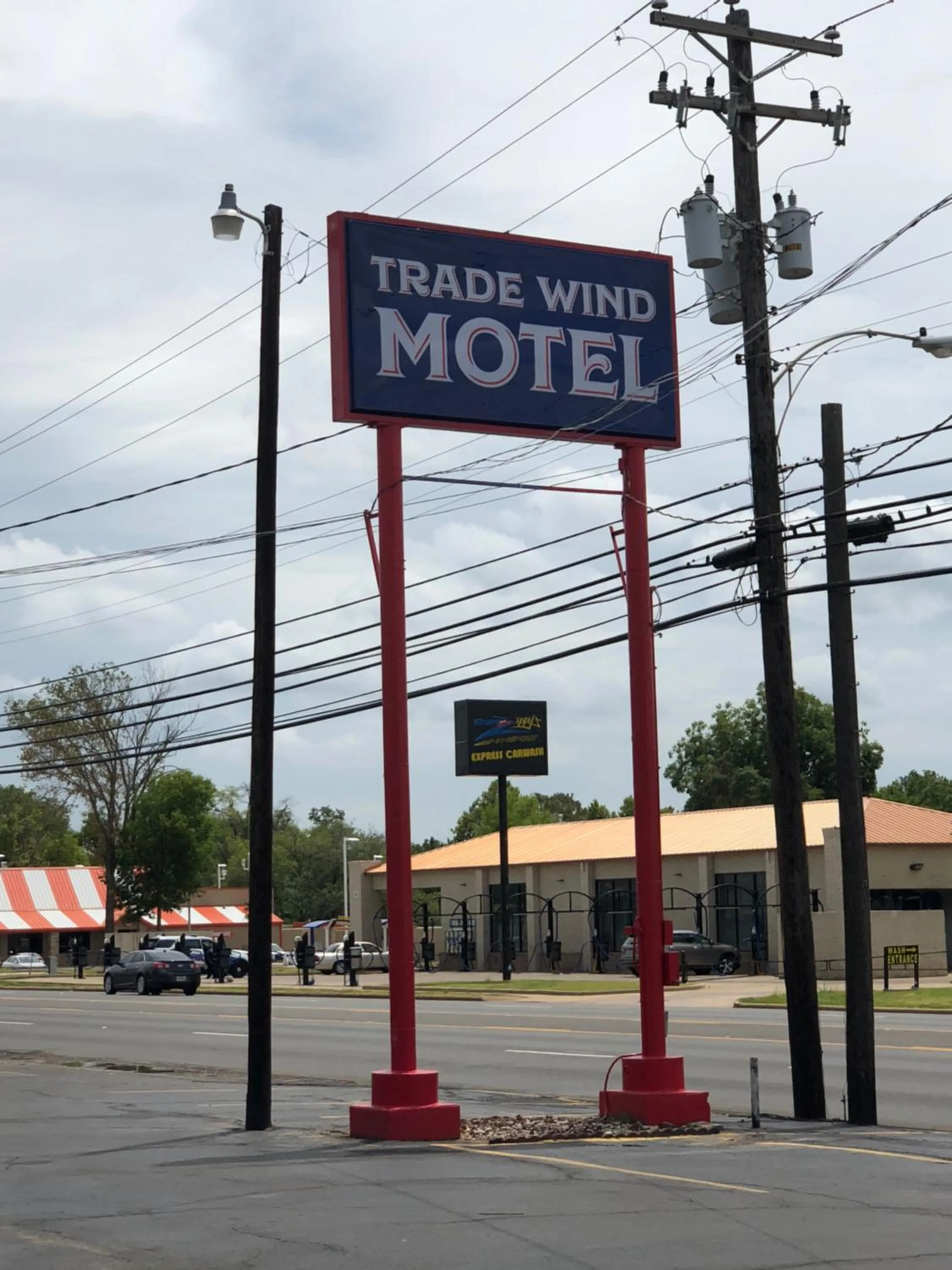 Property logo or sign in Trade Wind Motel