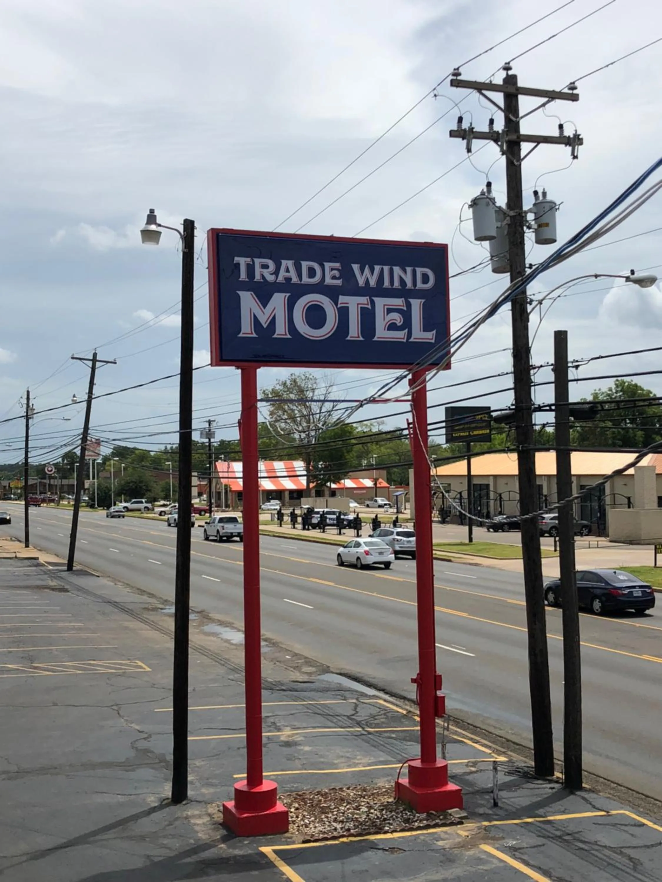 Property logo or sign in Trade Wind Motel