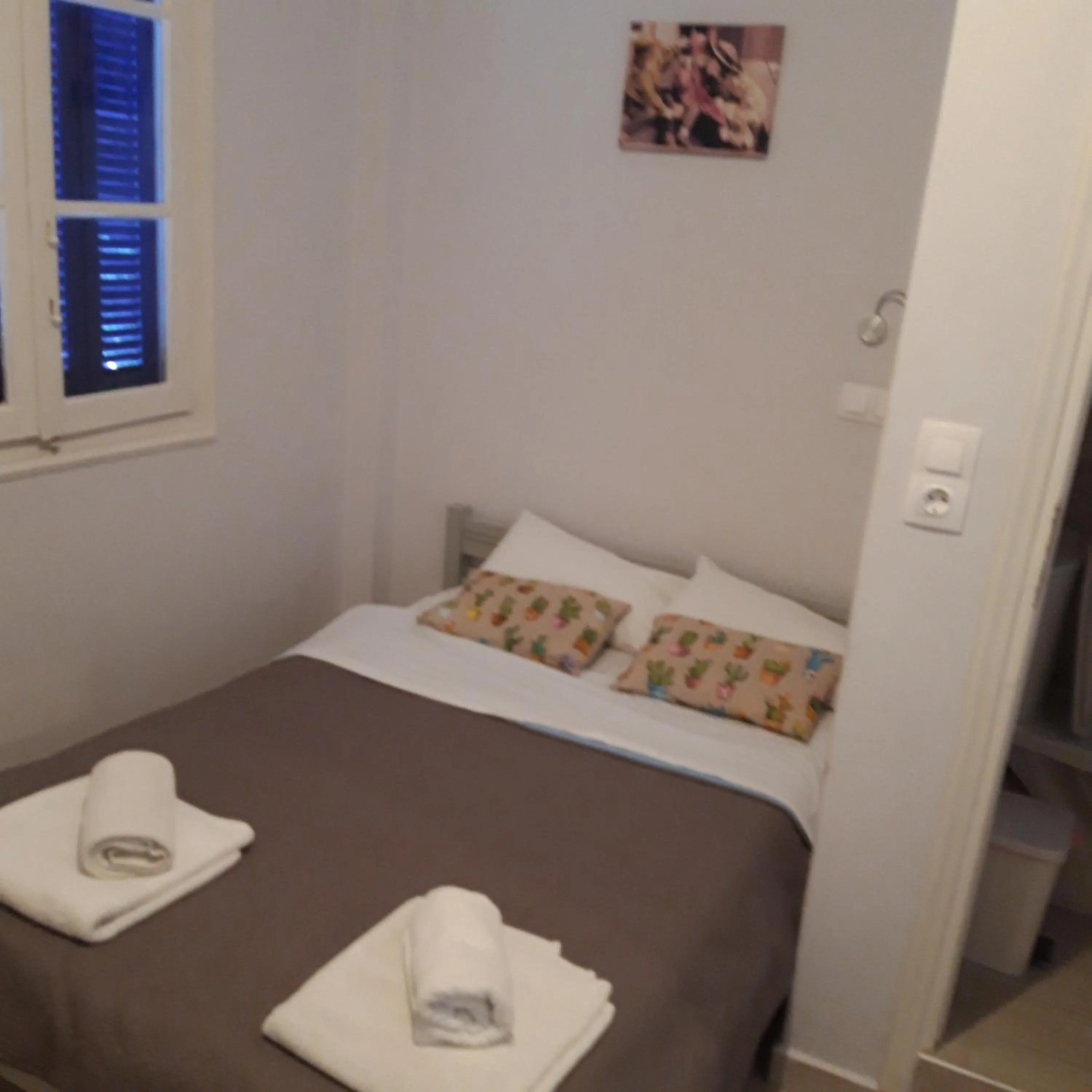 Bed in Aphrodite Art Hotel Aegina