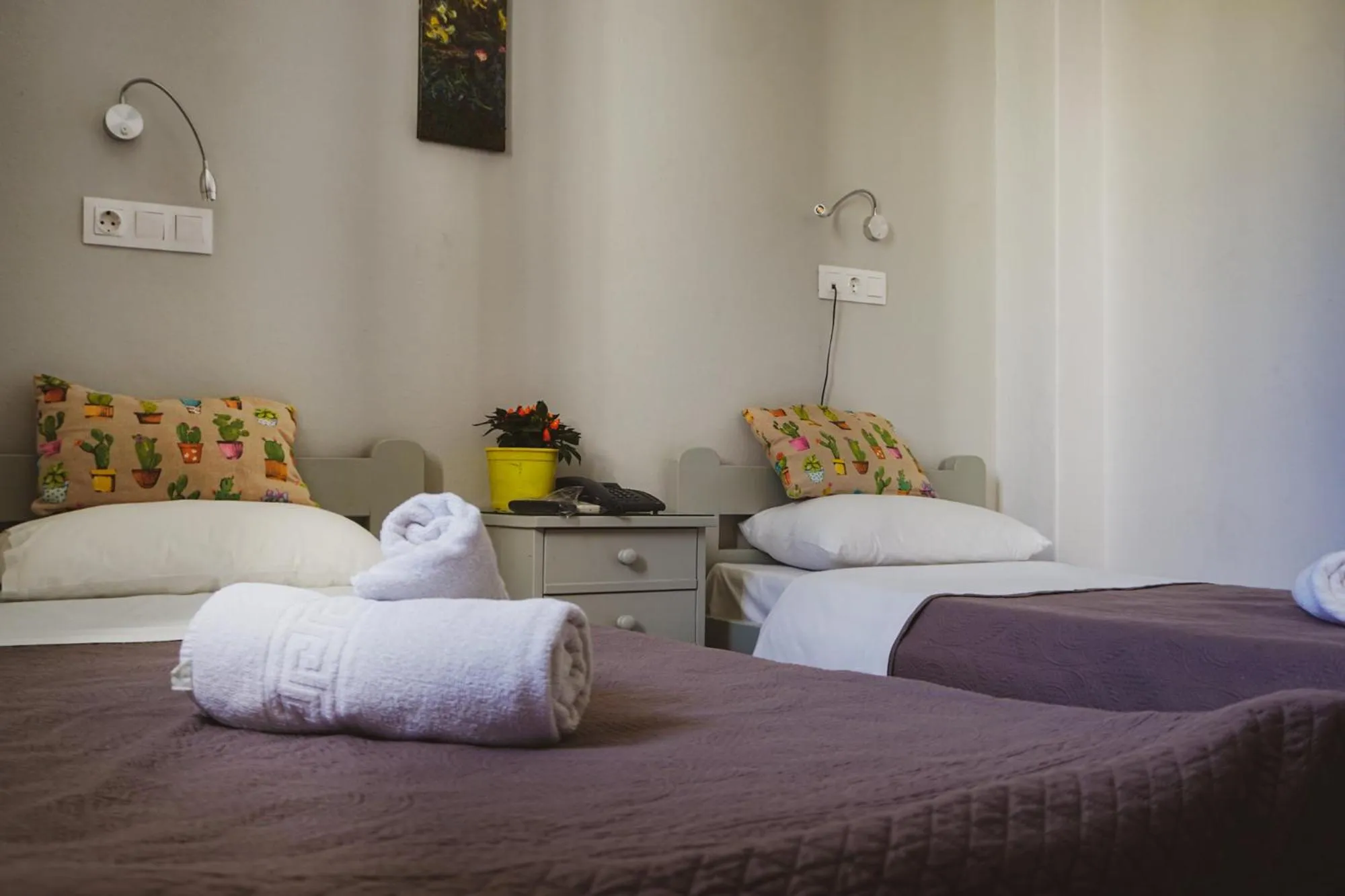 Bed in Aphrodite Art Hotel Aegina
