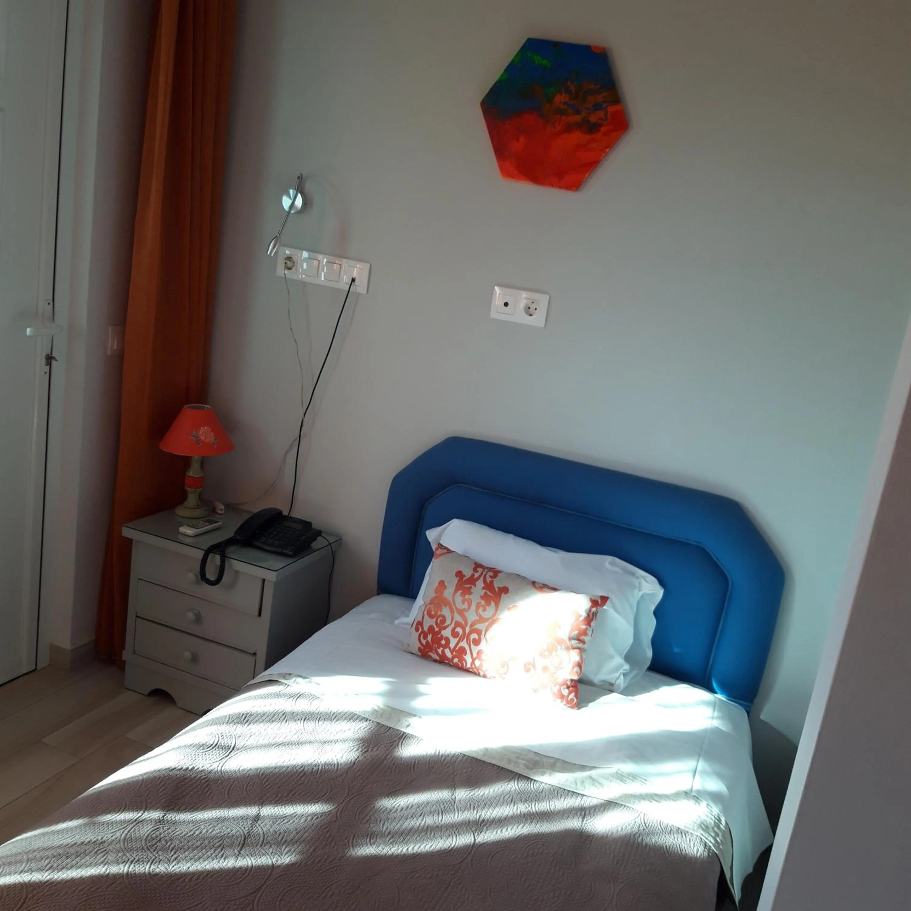 Bed in Aphrodite Art Hotel Aegina