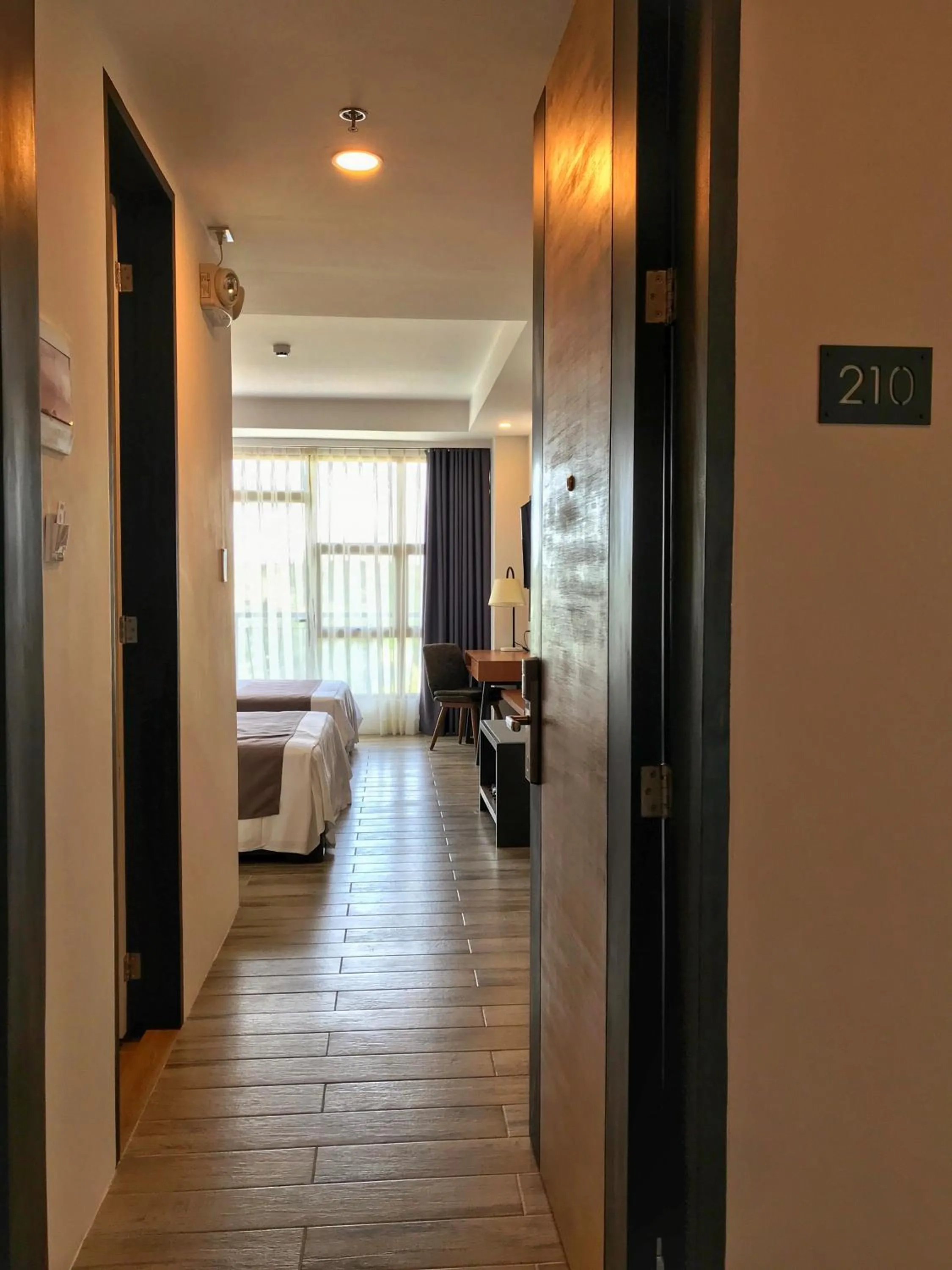 Photo of the whole room, Bed in Crown Hotel at Harbour Springs Palawan Managed by Enderun Hotels