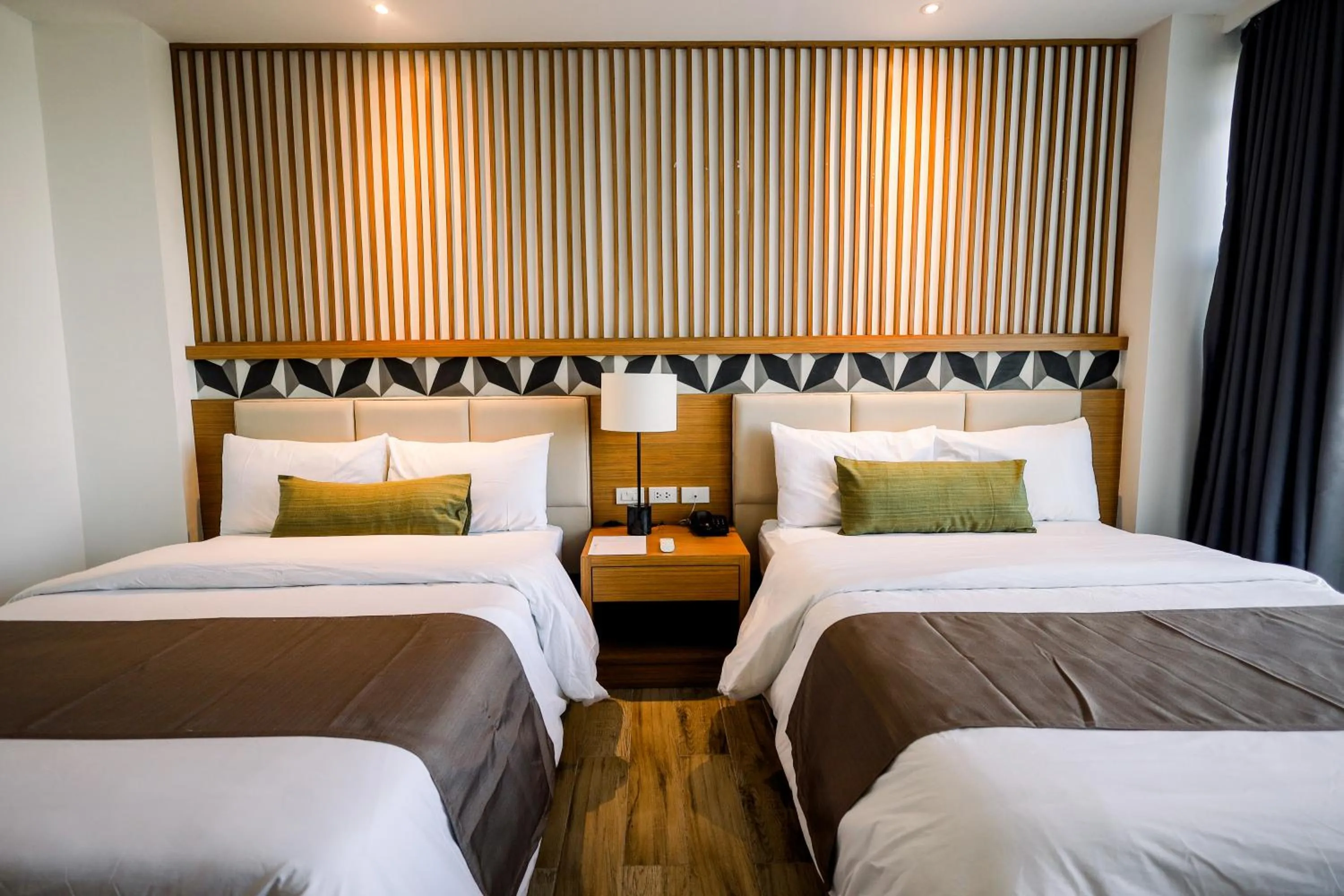 Photo of the whole room, Bed in Crown Hotel at Harbour Springs Palawan Managed by Enderun Hotels