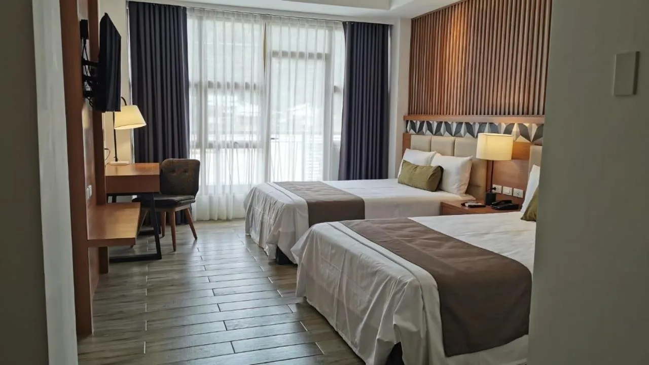 Photo of the whole room, Bed in Crown Hotel at Harbour Springs Palawan Managed by Enderun Hotels