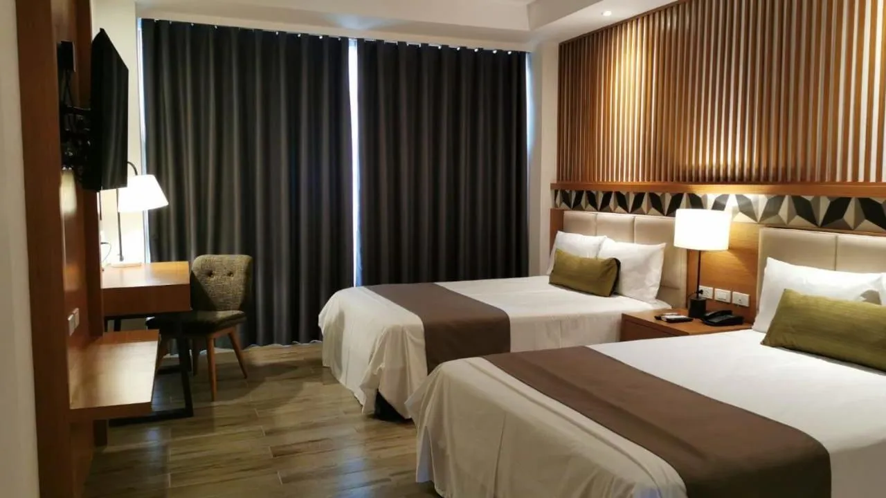 Photo of the whole room, Bed in Crown Hotel at Harbour Springs Palawan Managed by Enderun Hotels