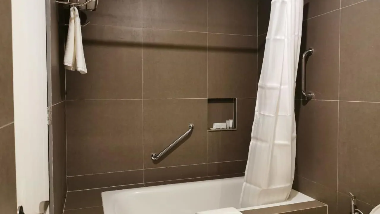 Shower in Crown Hotel at Harbour Springs Palawan Managed by Enderun Hotels