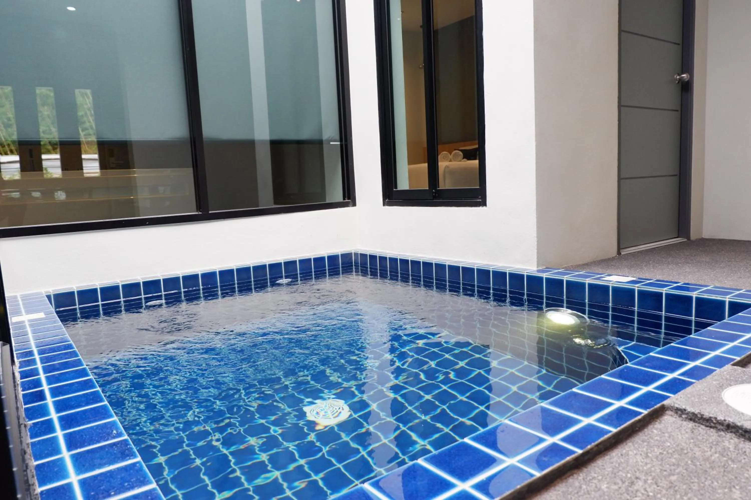 Swimming pool in Chill D Resort Buriram