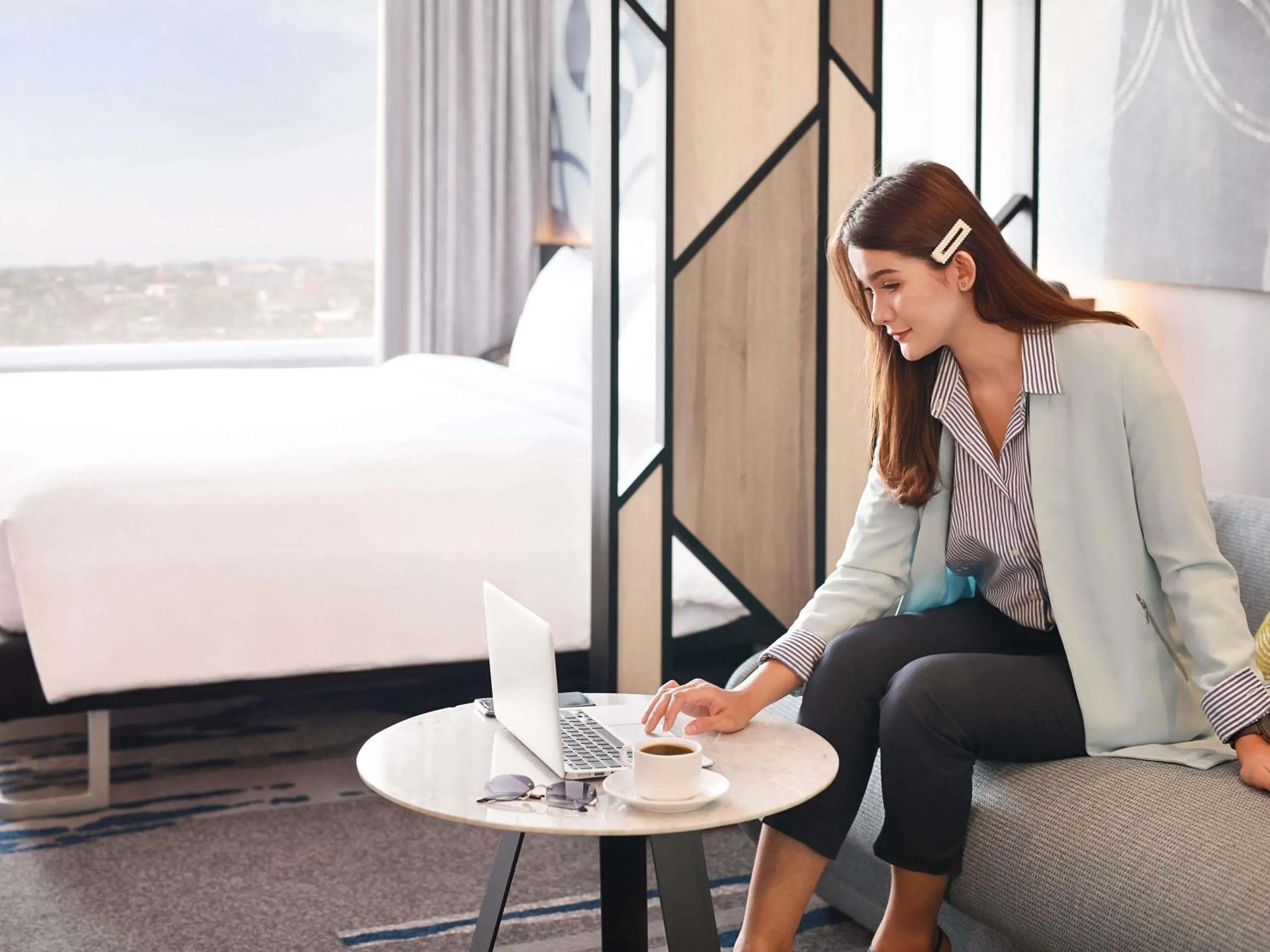 Bedroom in Novotel Suites Yogyakarta Malioboro
