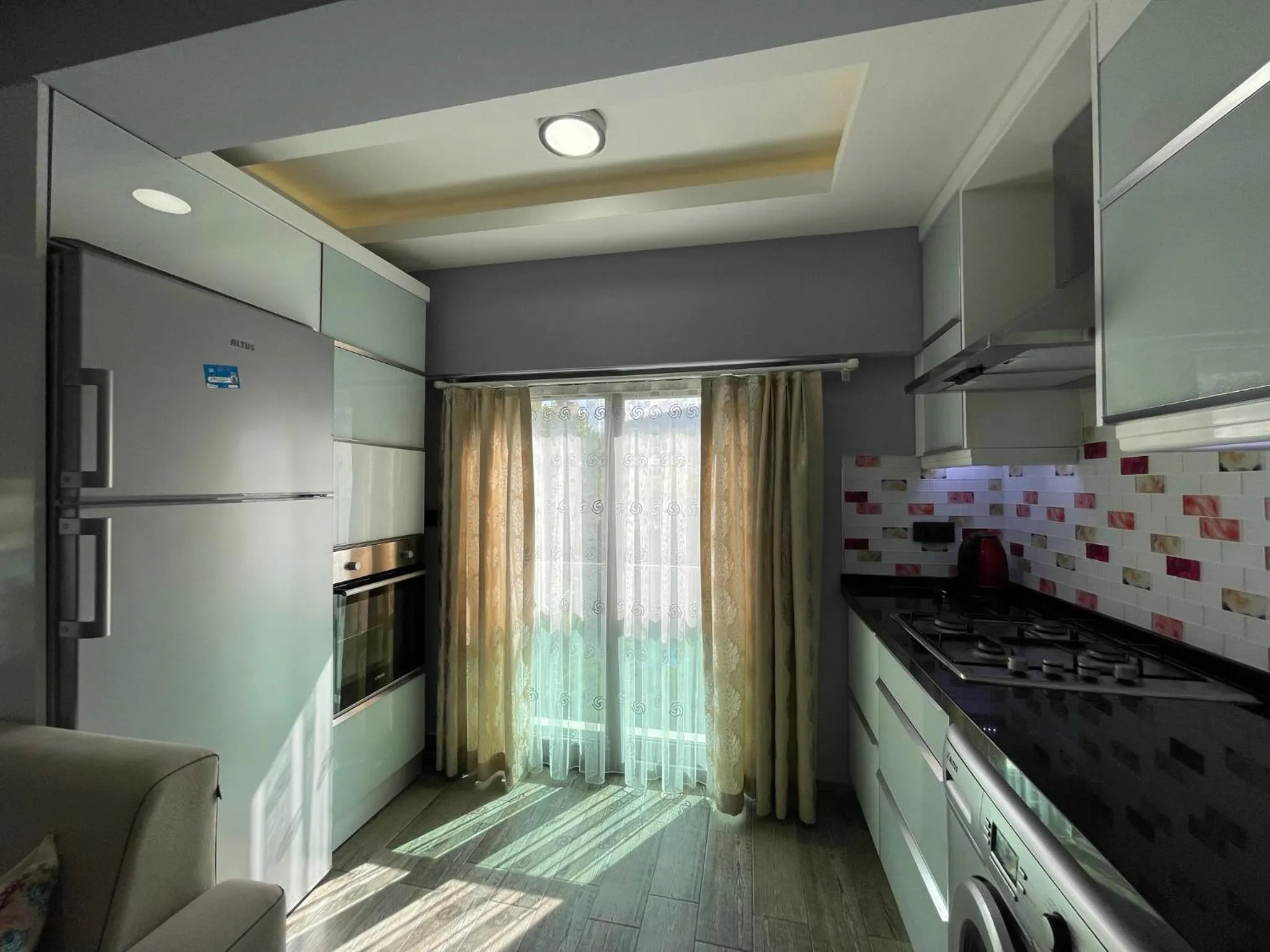 Kitchen or kitchenette in X SUITE APART