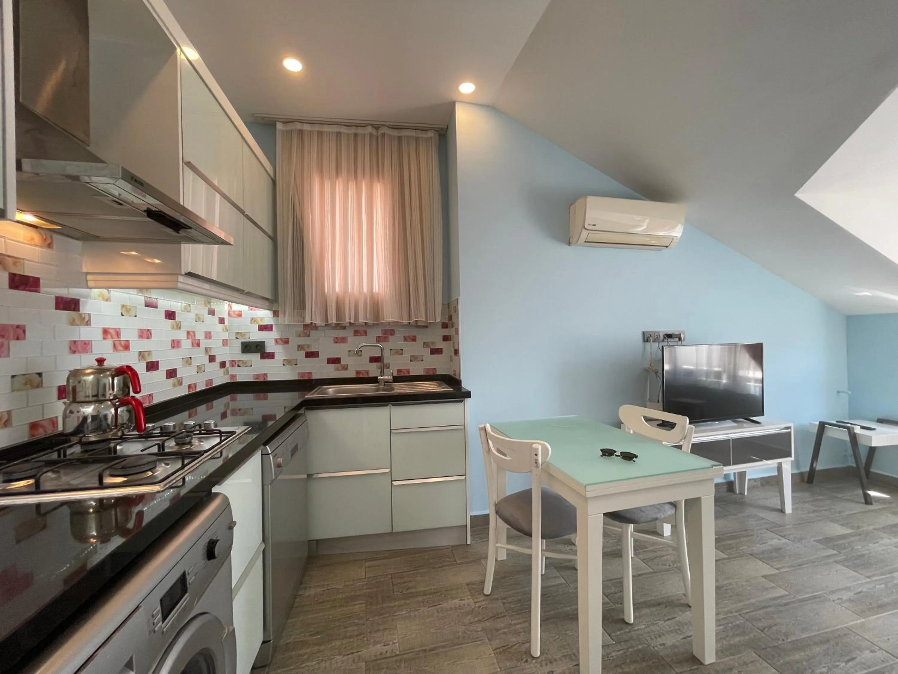 Kitchen or kitchenette in X SUITE APART