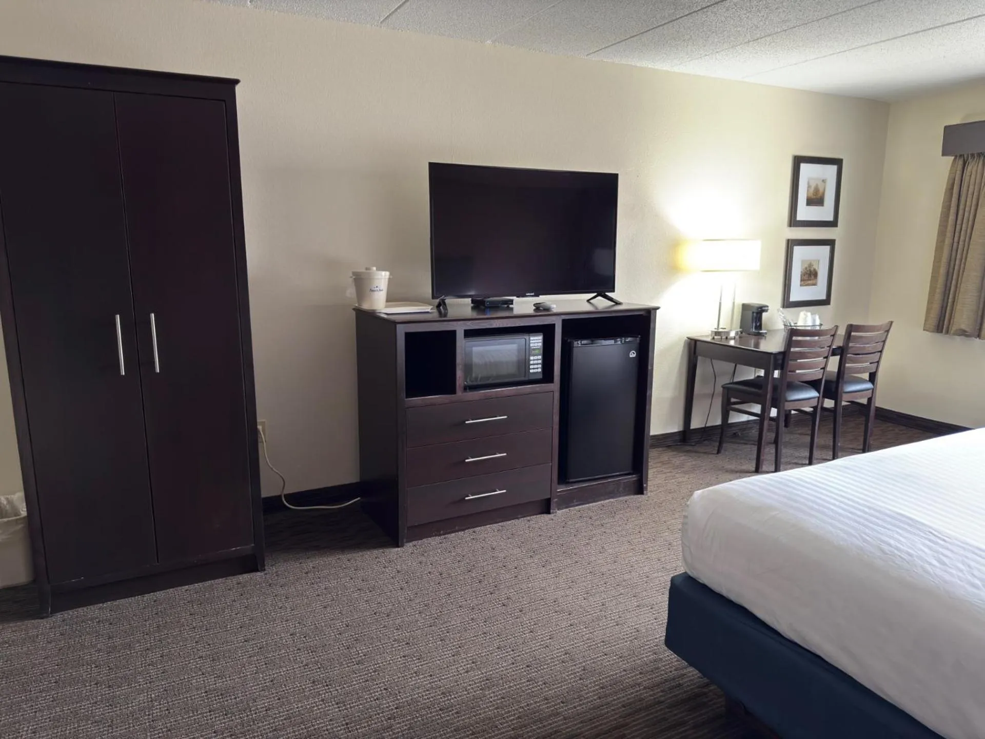 Bed in AmericInn by Wyndham Northfield