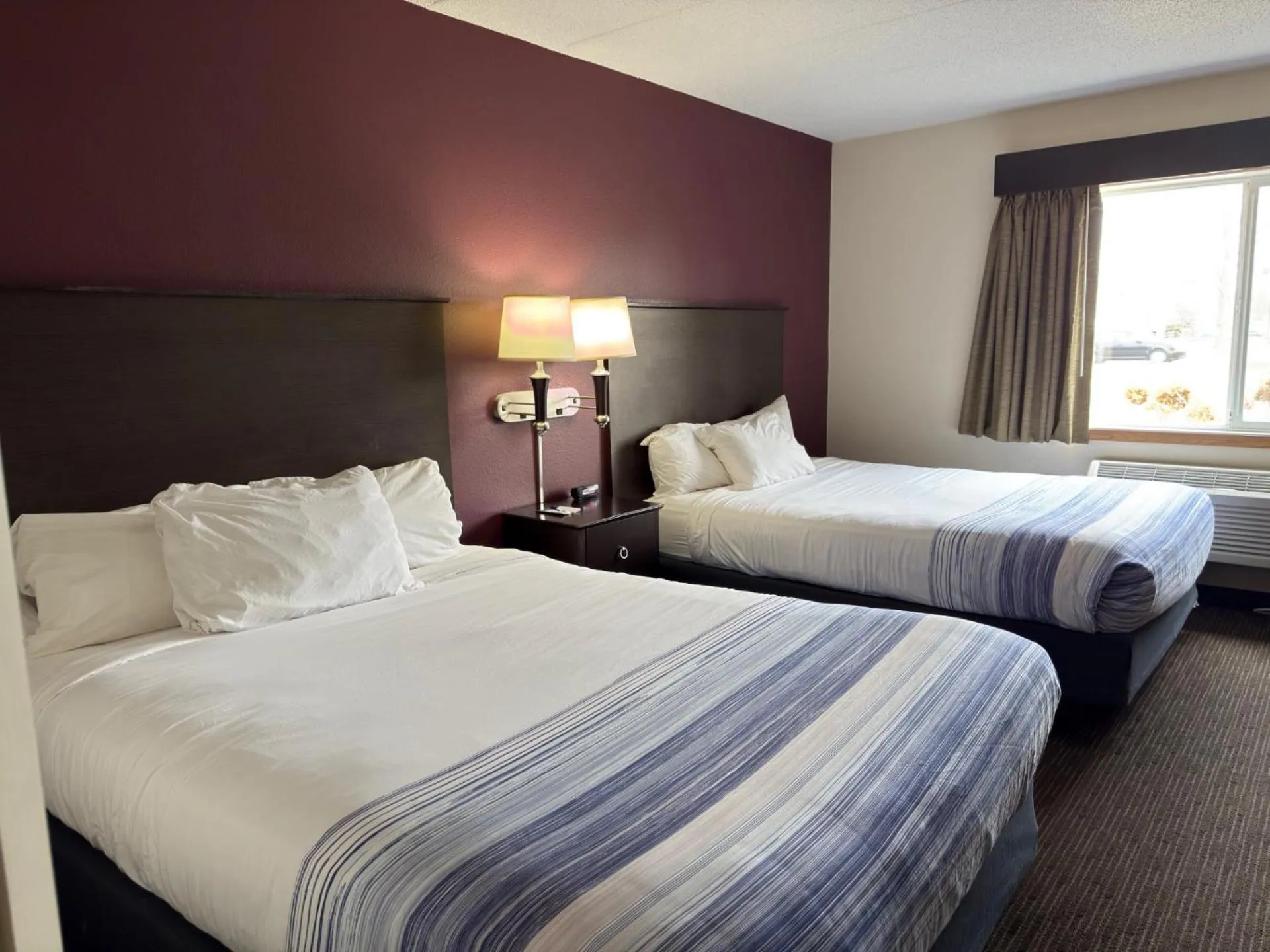 Bed in AmericInn by Wyndham Northfield