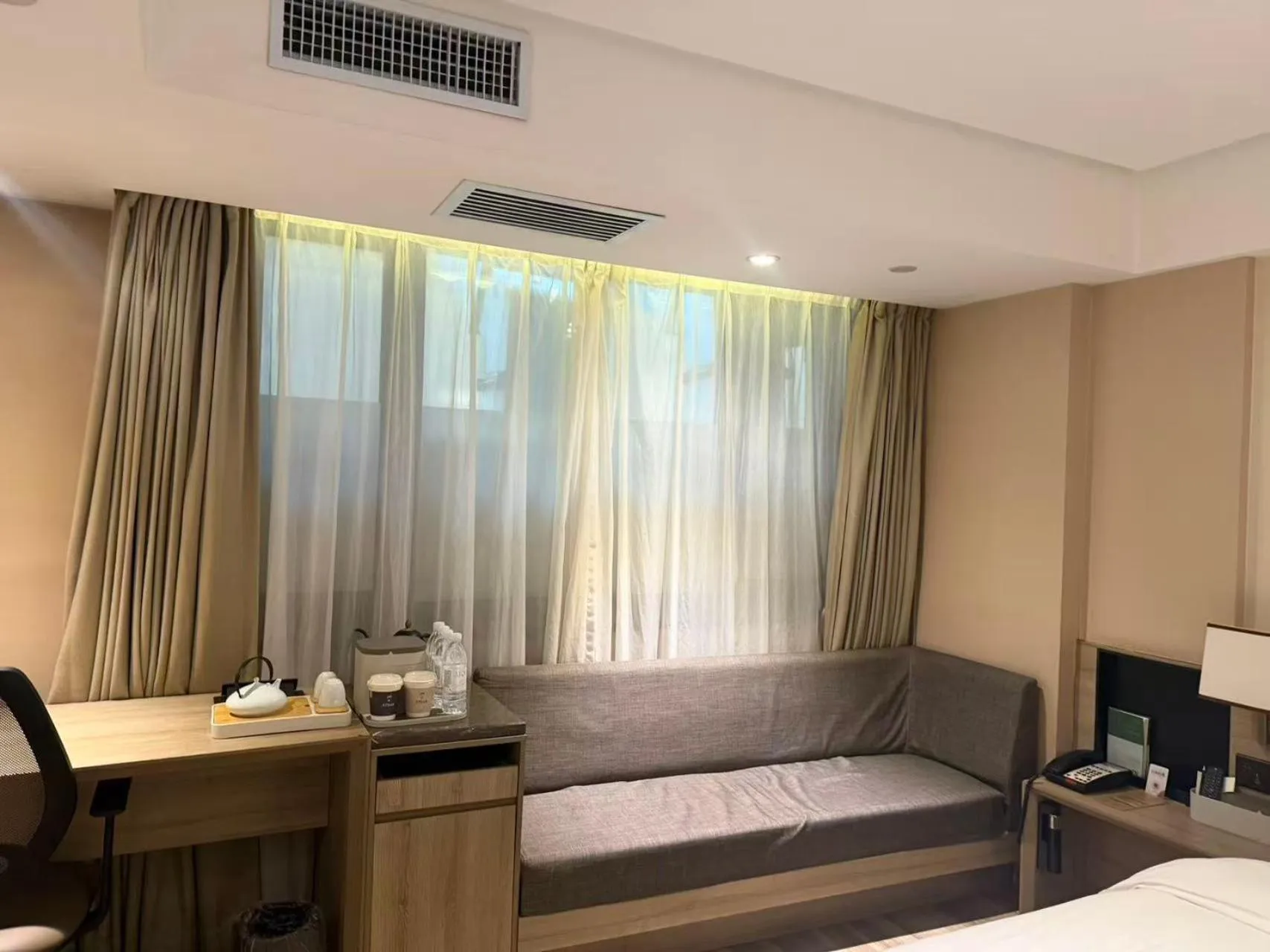 Living room, Bed in Atour Harbin Museum Hotel